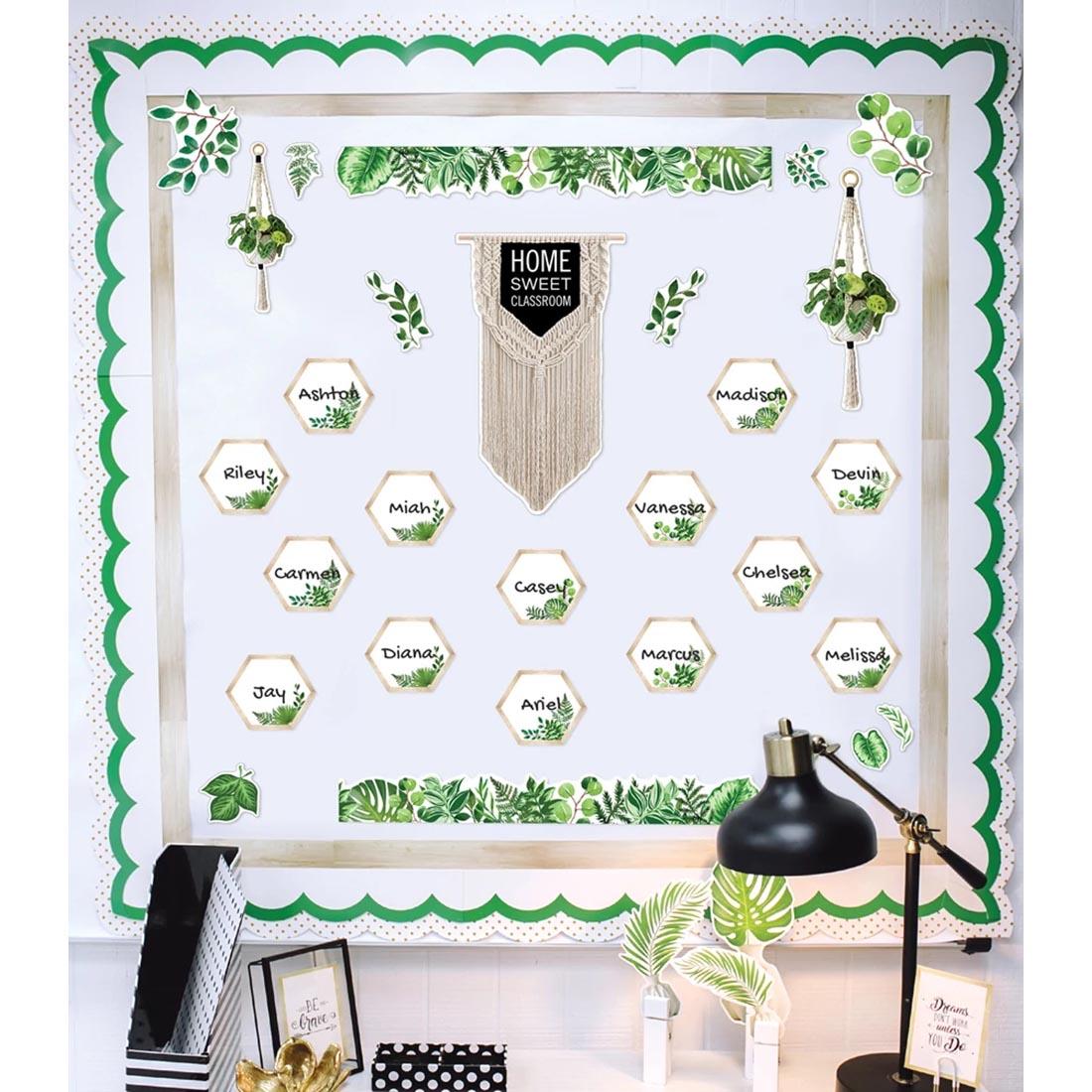 Simply Boho Home Sweet Classroom Bulletin Board Set By Carson Dellosa shown displayed on a board in front of a desk