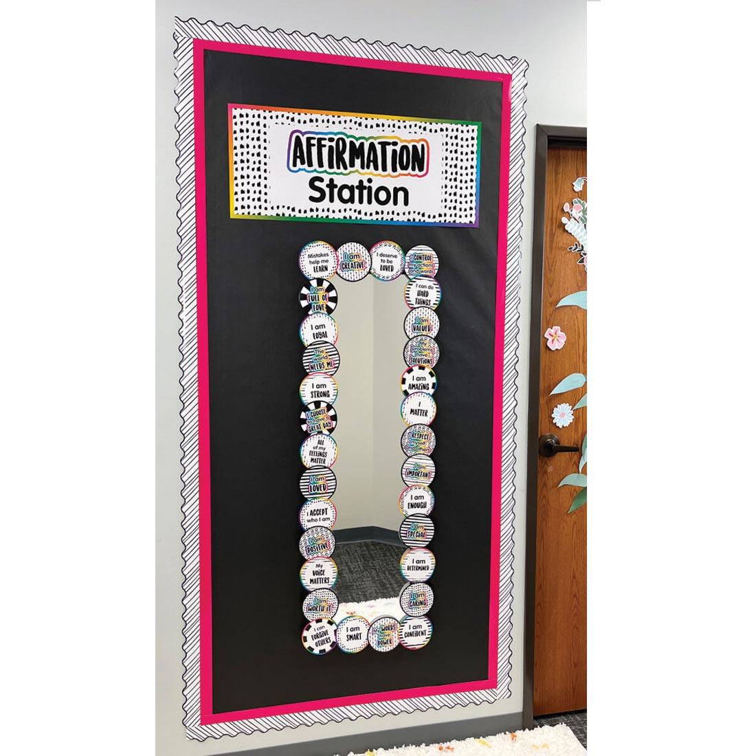 Affirmation Station Bulletin Board Set By Carson Dellosa framing a mirror on a bulletin board