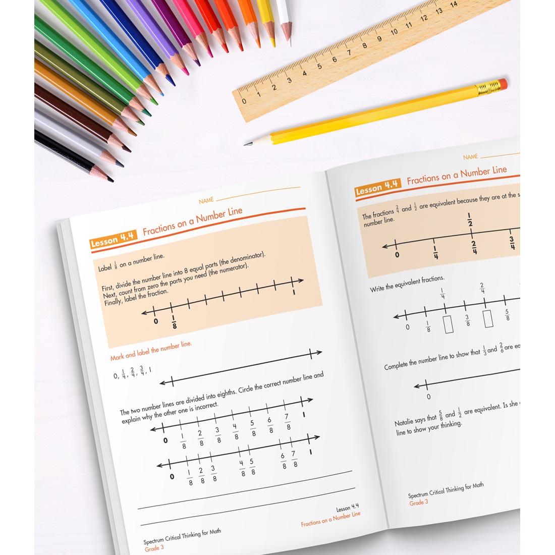 open book of Spectrum Critical Thinking For Math Grade 3 along with colored pencils, a ruler and a pencil