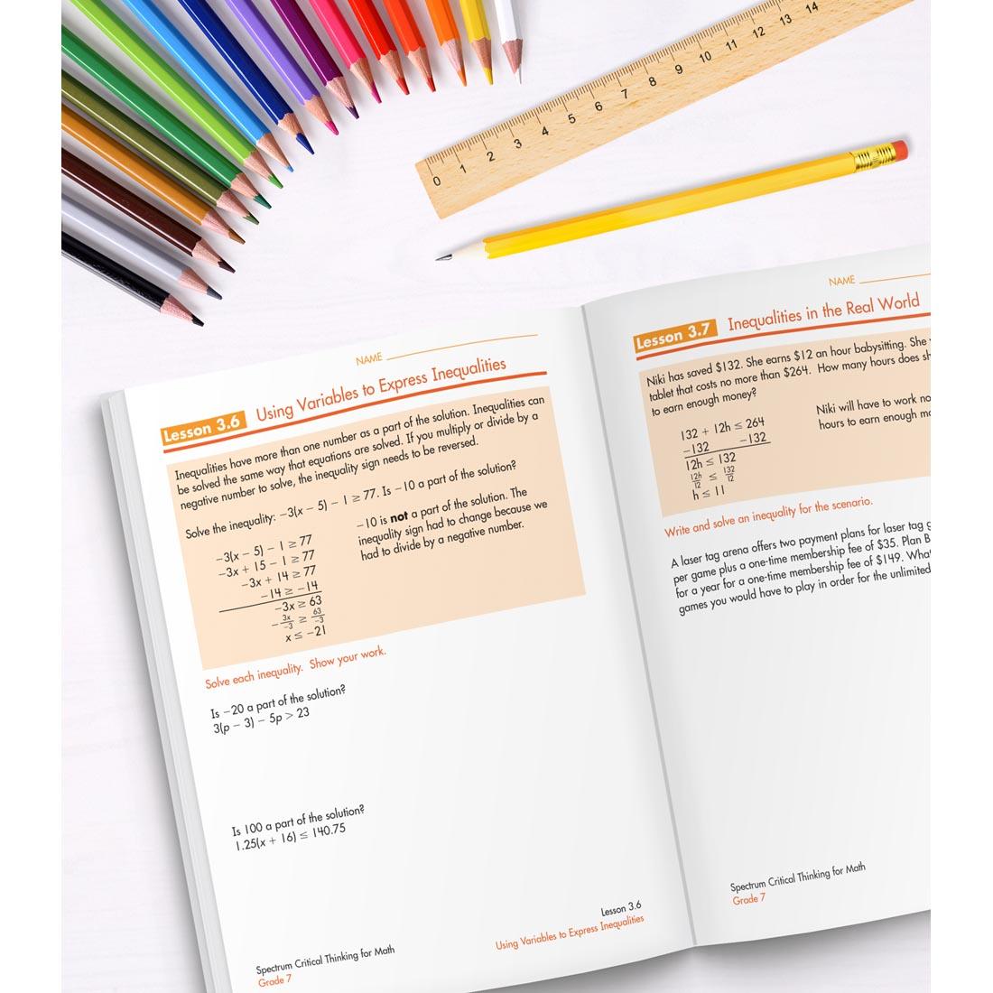 open book of Spectrum Critical Thinking For Math Grade 7 along with colored pencils, a ruler and a pencil