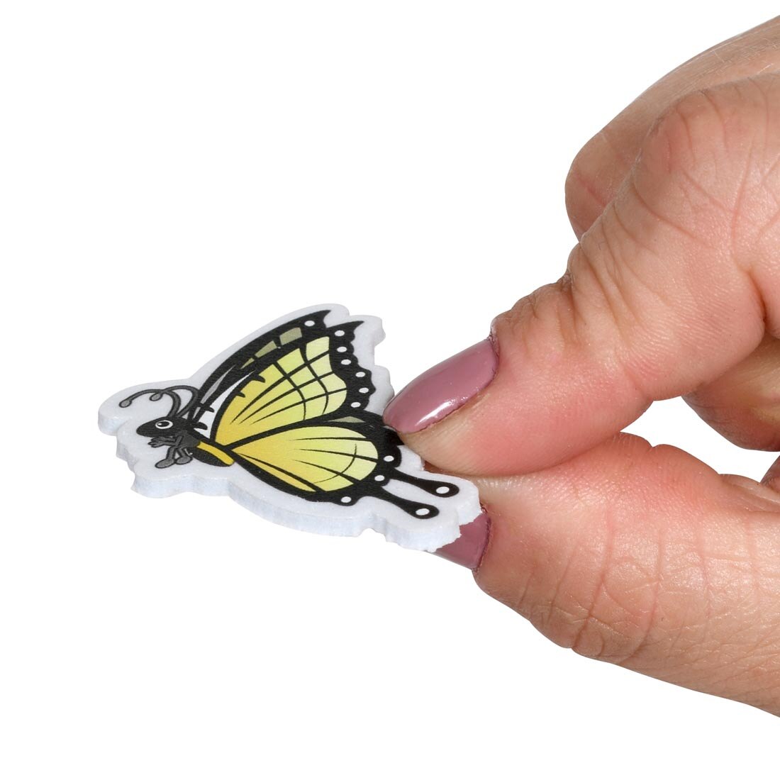 fingers holding a Ready 2 Learn Butterfly Foam Sticker