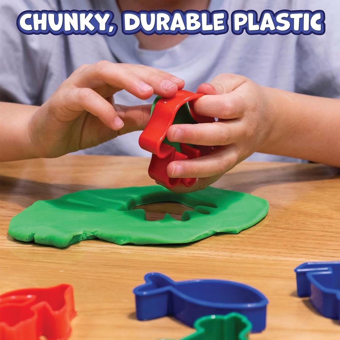 hands using Ready 2 Learn Dough Cutters with green dough plus text Chunky, Durable Plastic