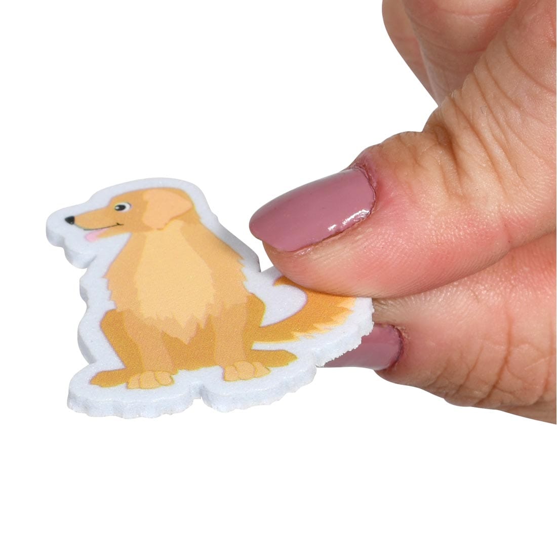 fingers holding a Ready 2 Learn Dog Foam Sticker