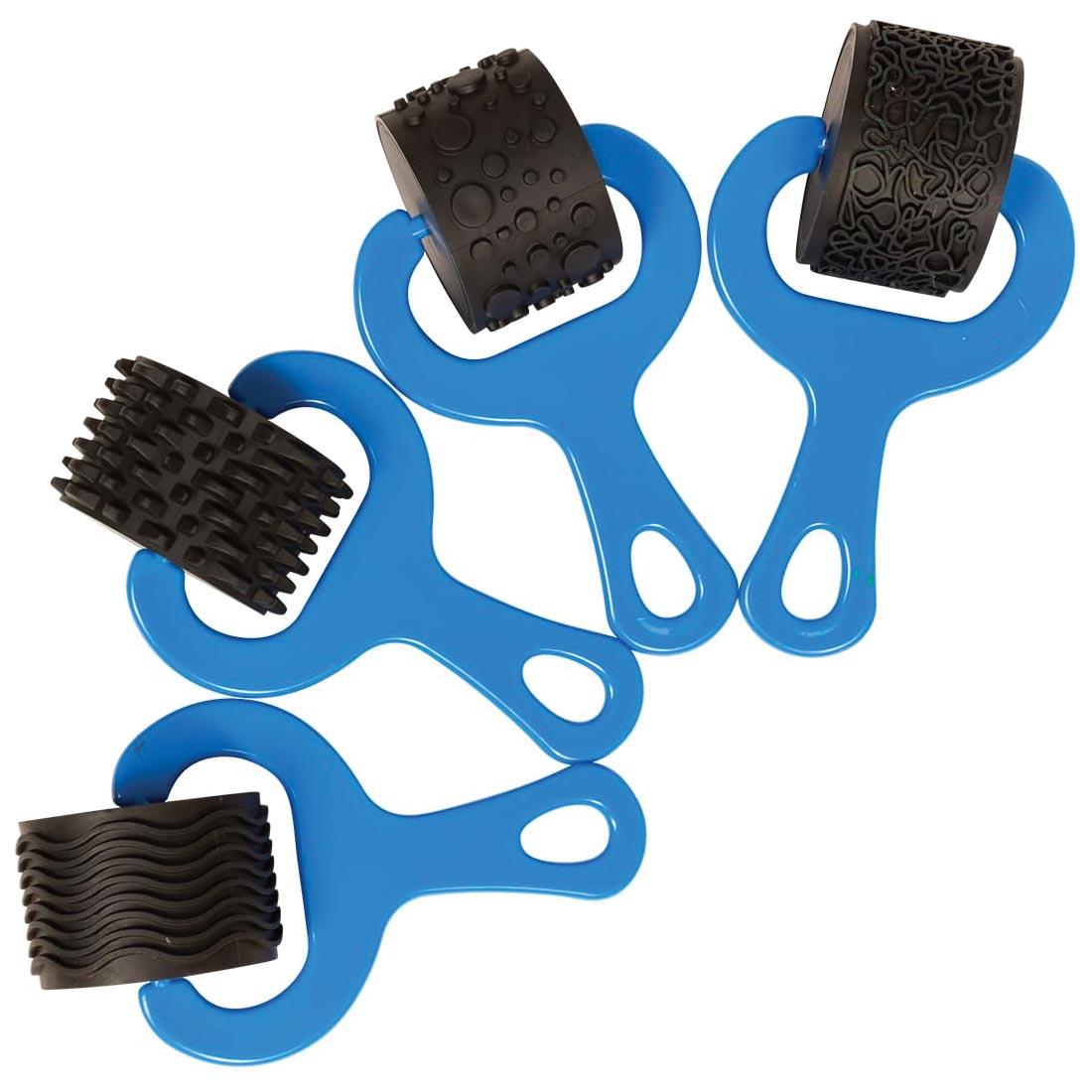 4 dough/paint rollers with different patterns