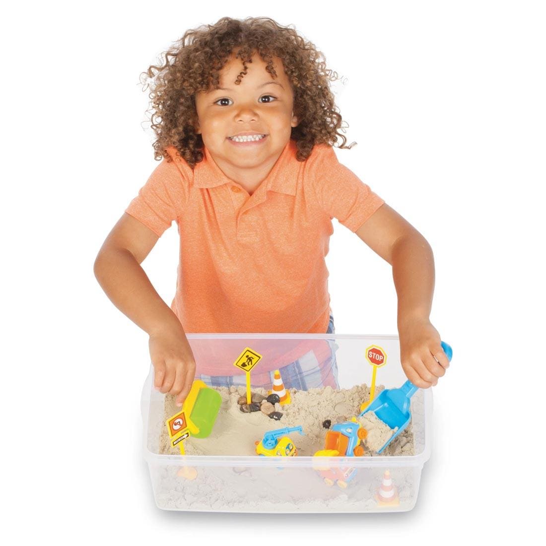 Child playing with the Construction Zone Sensory Bin By Creativity For Kids