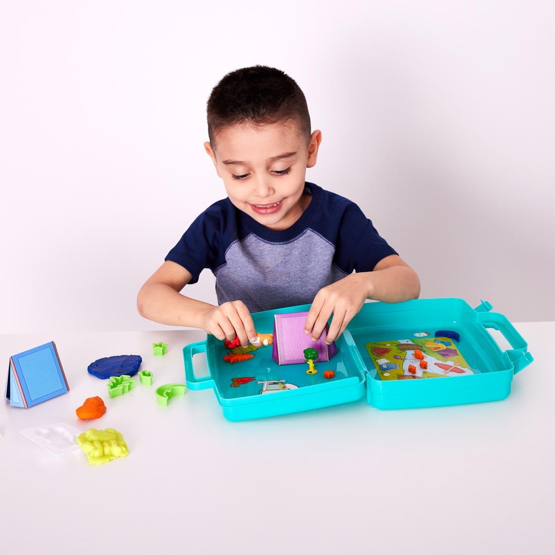 child playing with Sensory On The Go Camping Fun
