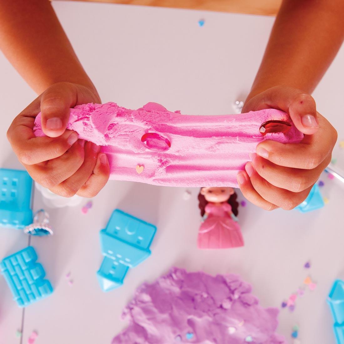 child's hands playing with clay from the Princess Sensory Pack By Creativity For Kids
