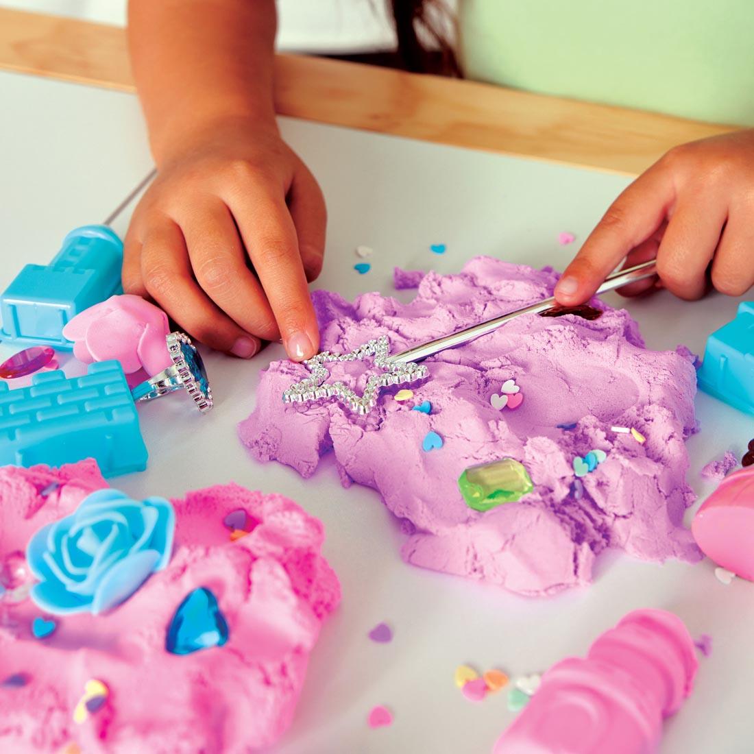 child's hands using items from the Princess Sensory Pack By Creativity For Kids