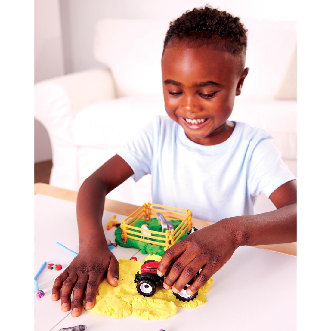 child playing with the Farm Sensory Pack By Creativity For Kids