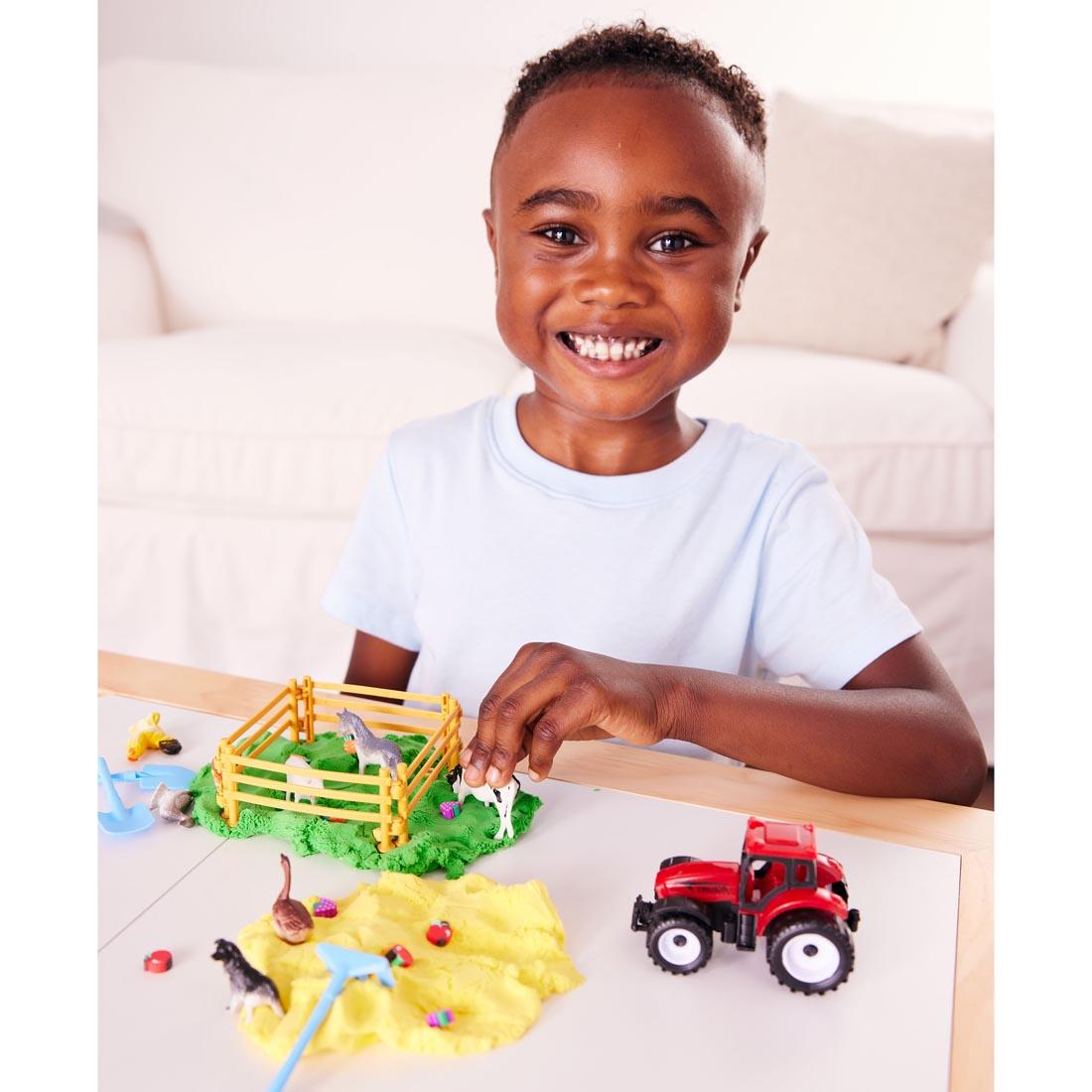 child playing with the Farm Sensory Pack By Creativity For Kids