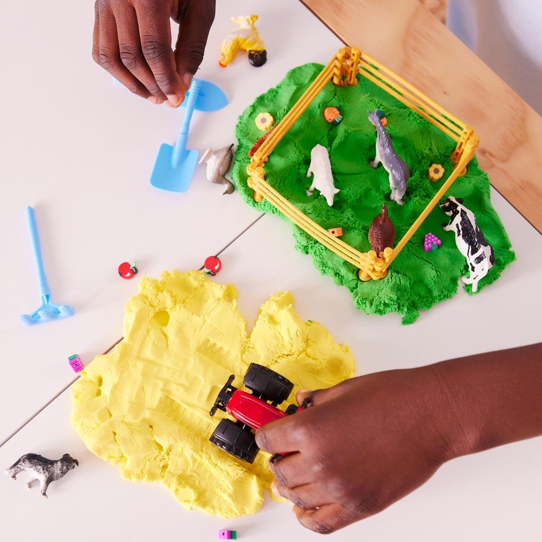child's hands playing with the Farm Sensory Pack By Creativity For Kids
