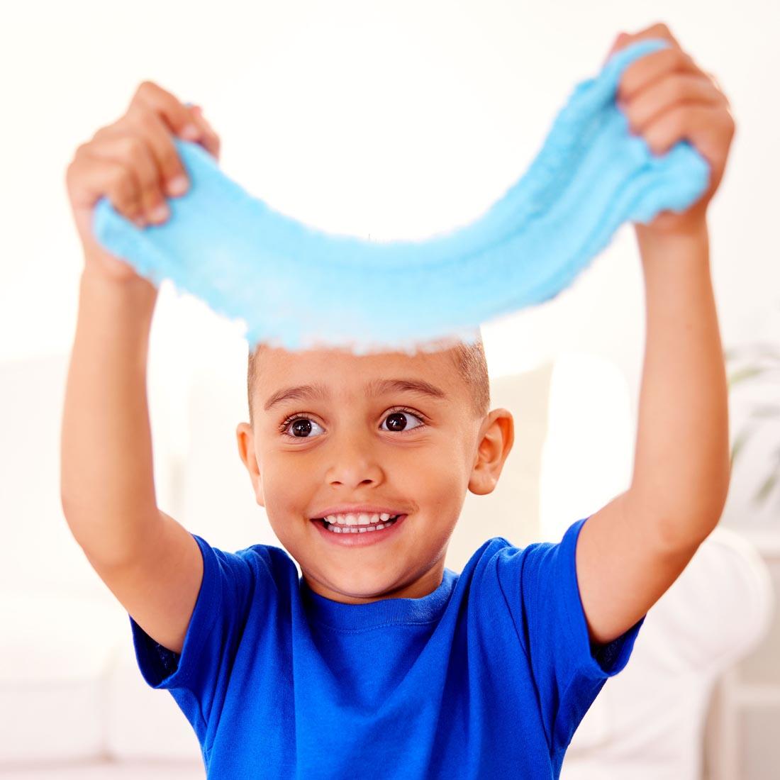 child stretching clay from the Outer Space Sensory Pack By Creativity For Kids