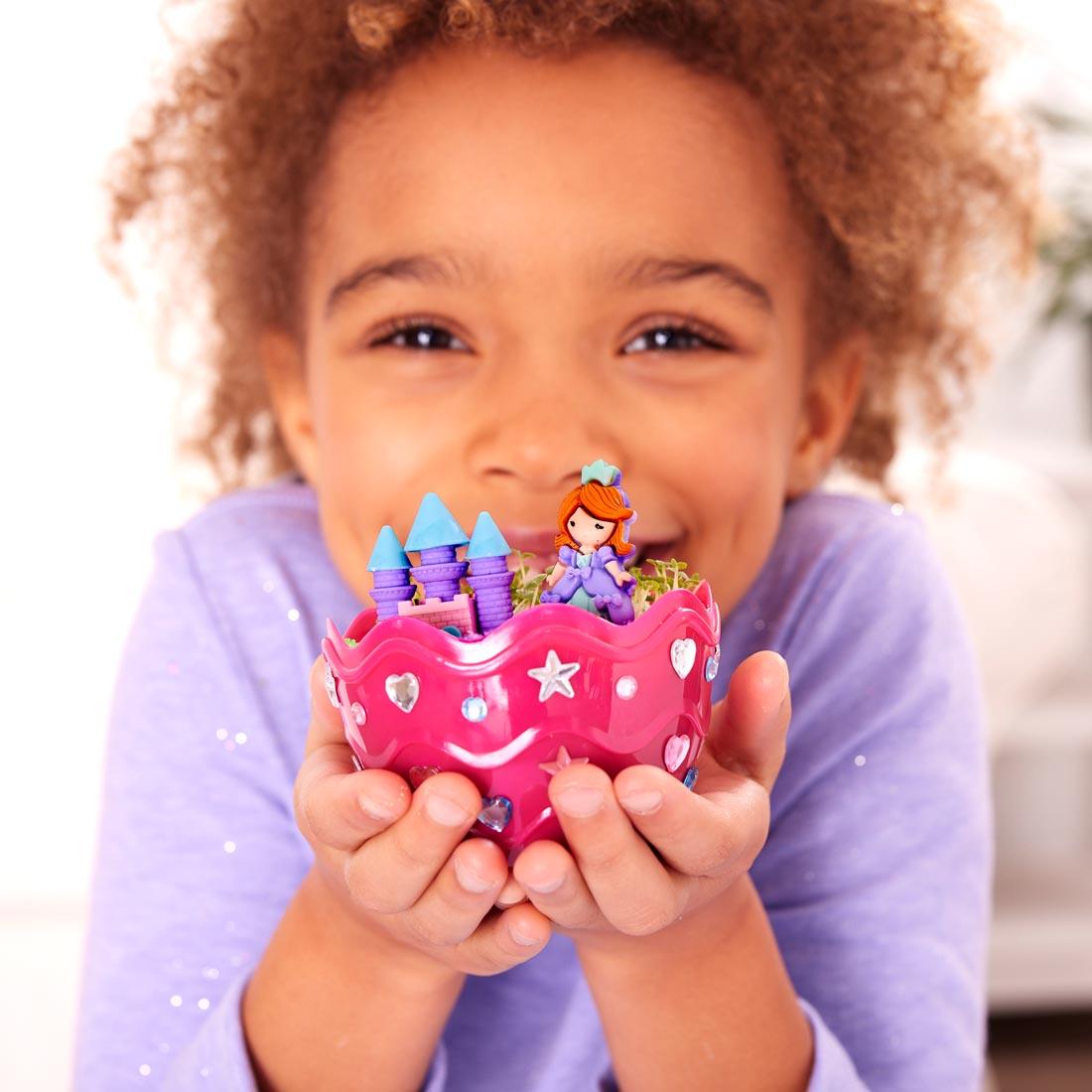 child holding a Princess Mini Garden By Creativity For Kids