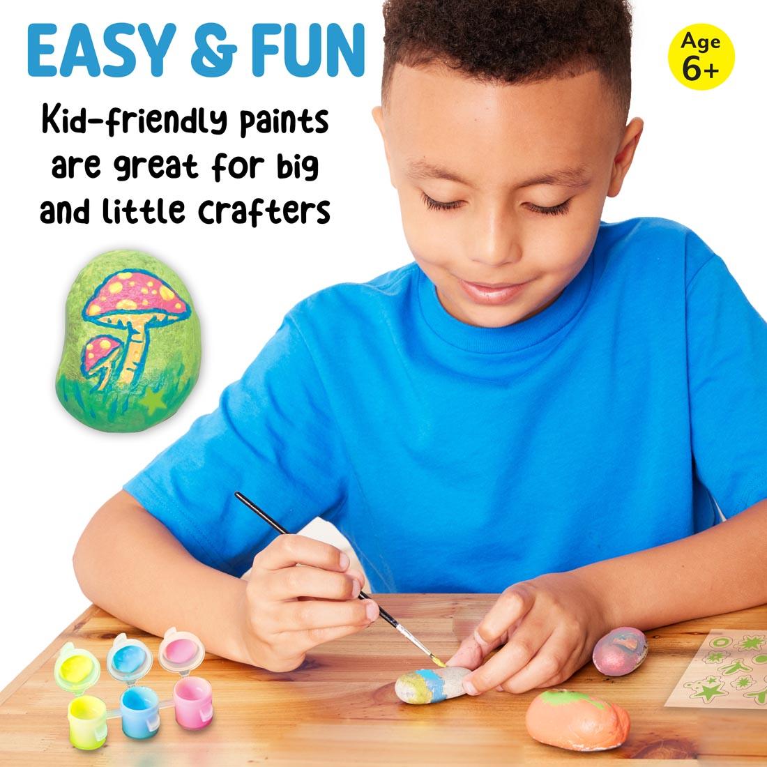 child painting Glow-In-The-Dark Rocks plus text Easy & Fun Kid-friendly paints are great for big and little crafters