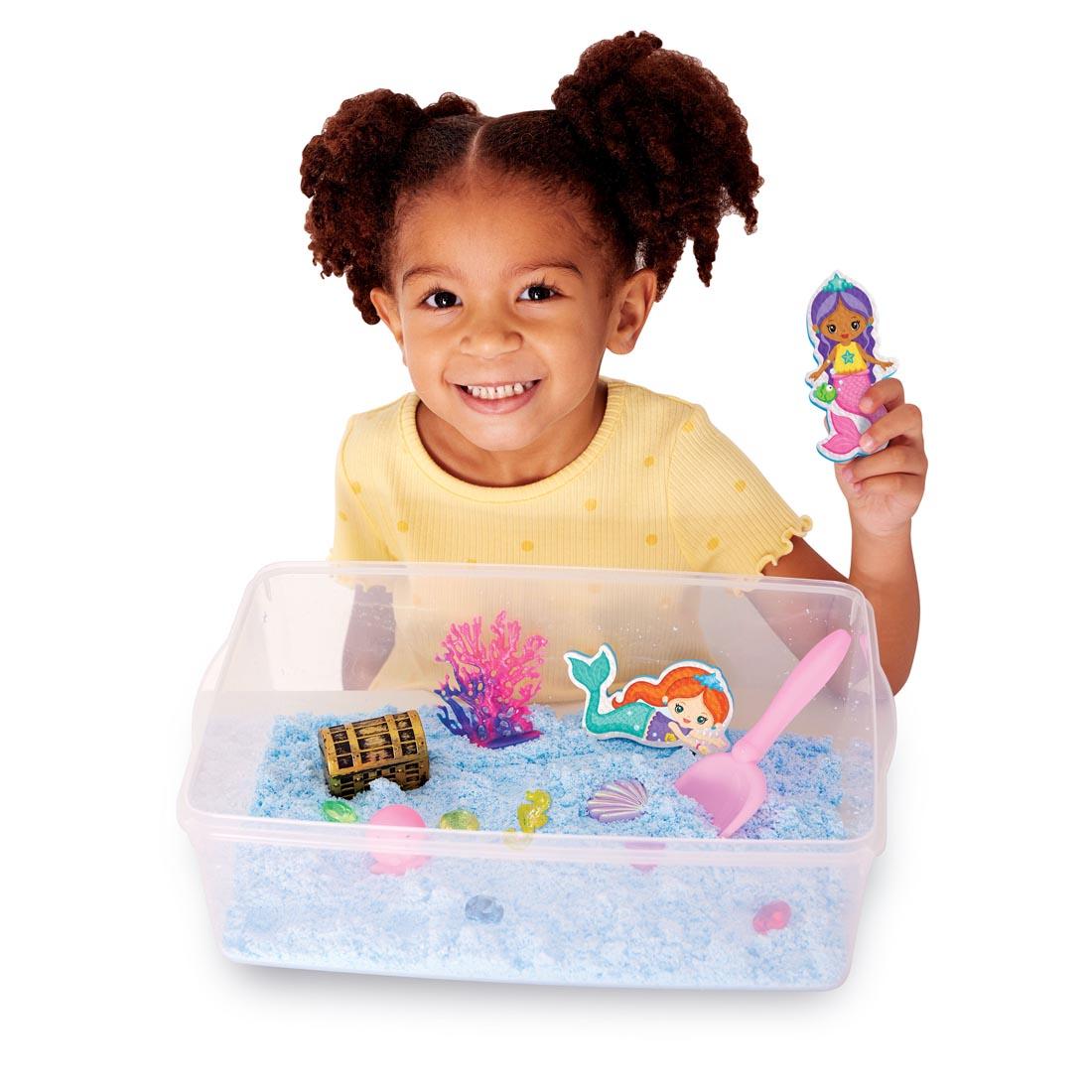 child playing with the Mermaid Sensory Bin