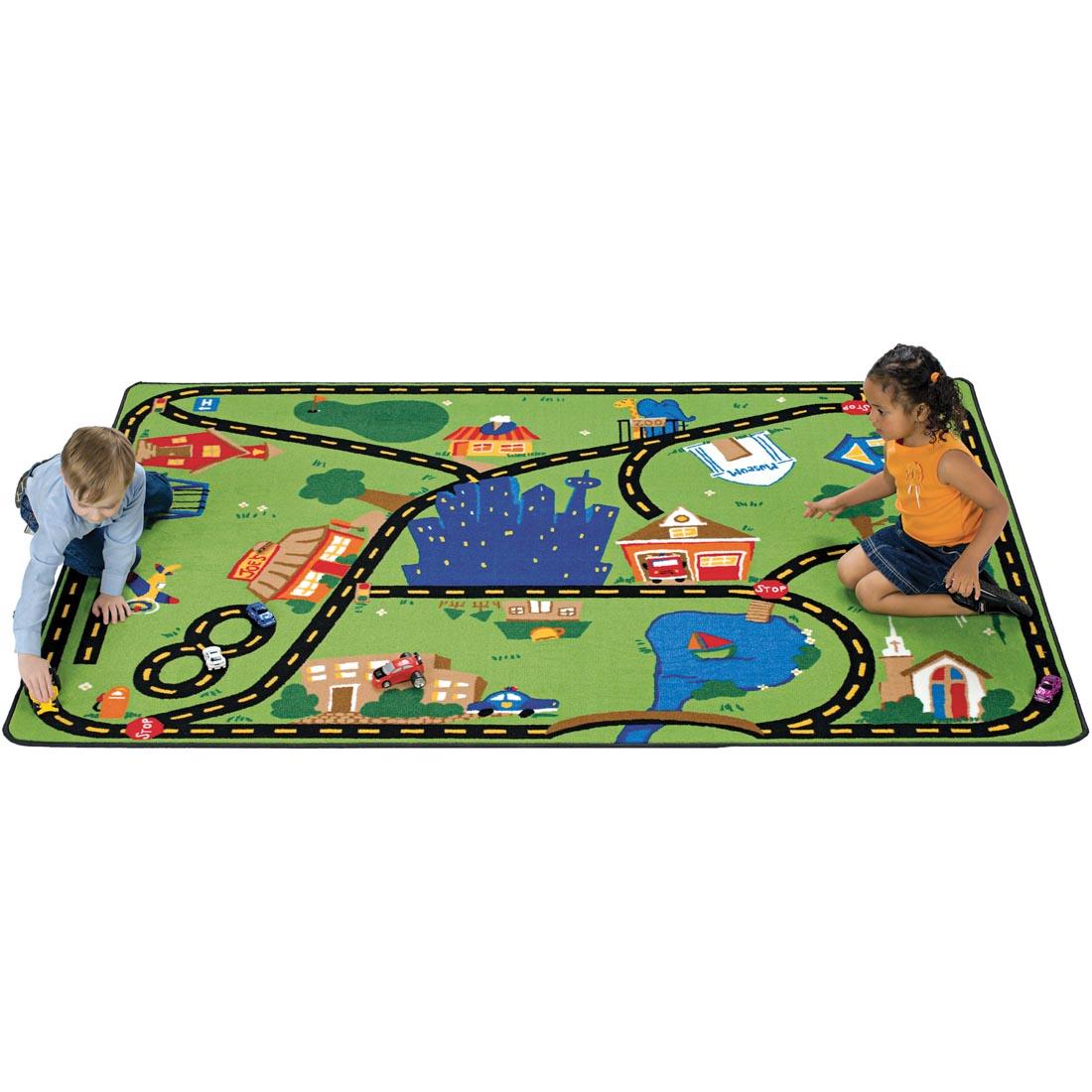 Children playing with cars on the roads printed on the Cruisin' Around The Town Rug by Carpets For Kids