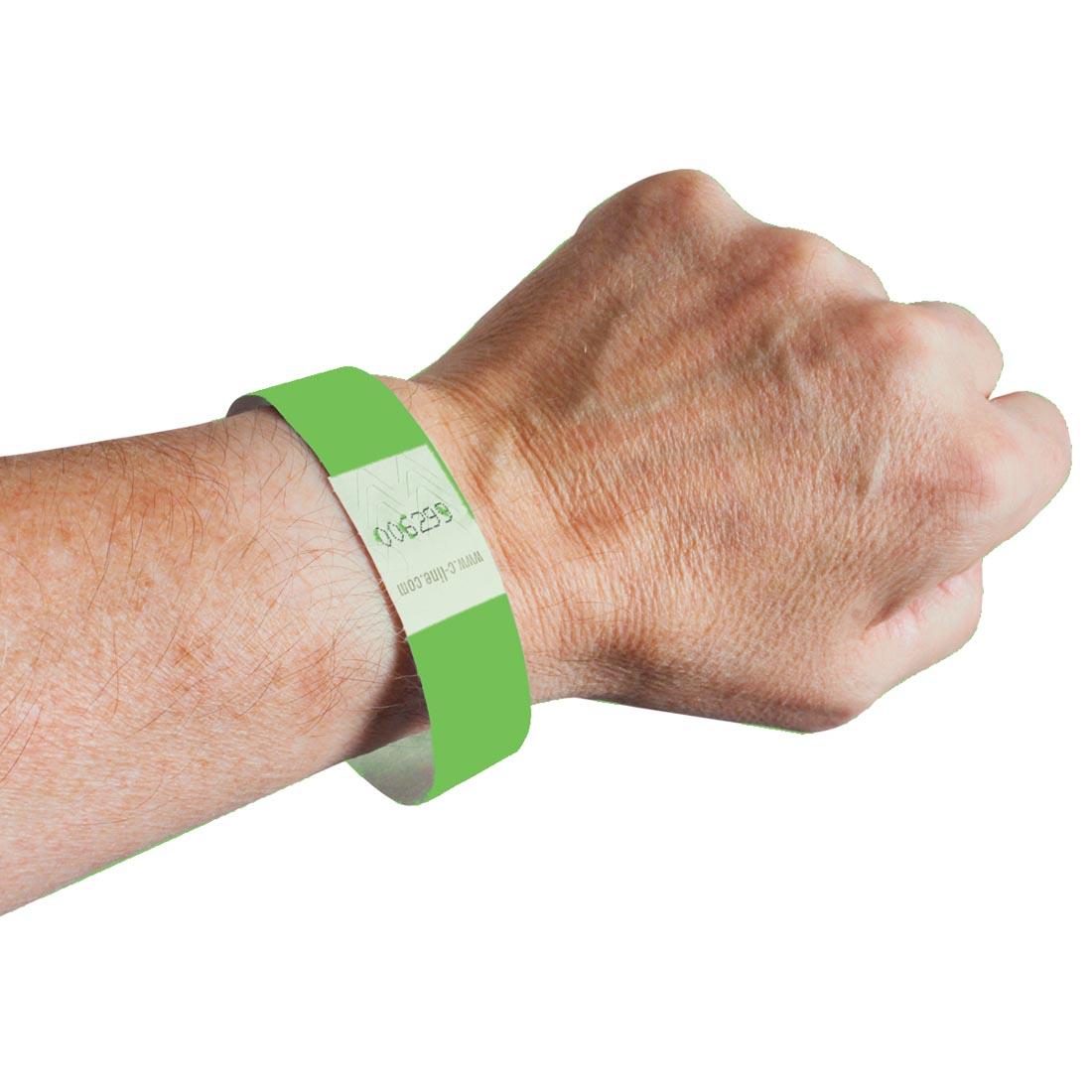 Green DuPont Tyvek Security Wristband on a wrist