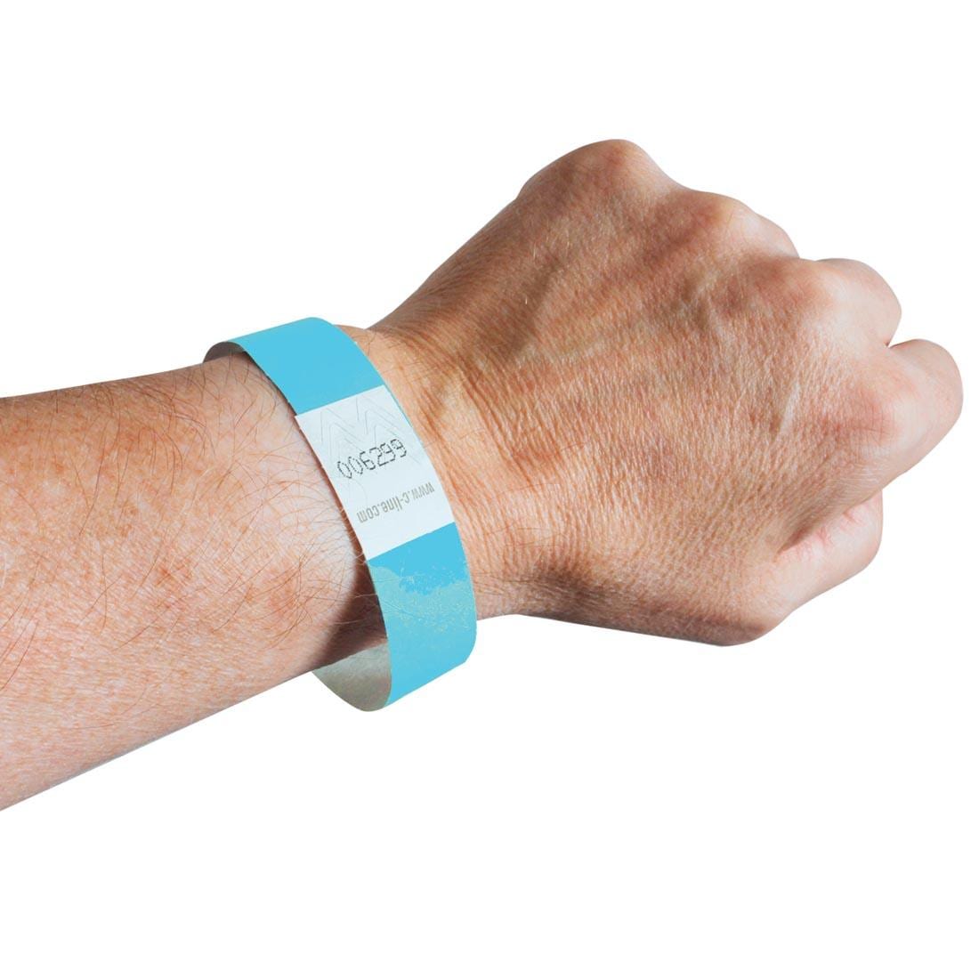 Blue DuPont Tyvek Security Wristband on a wrist