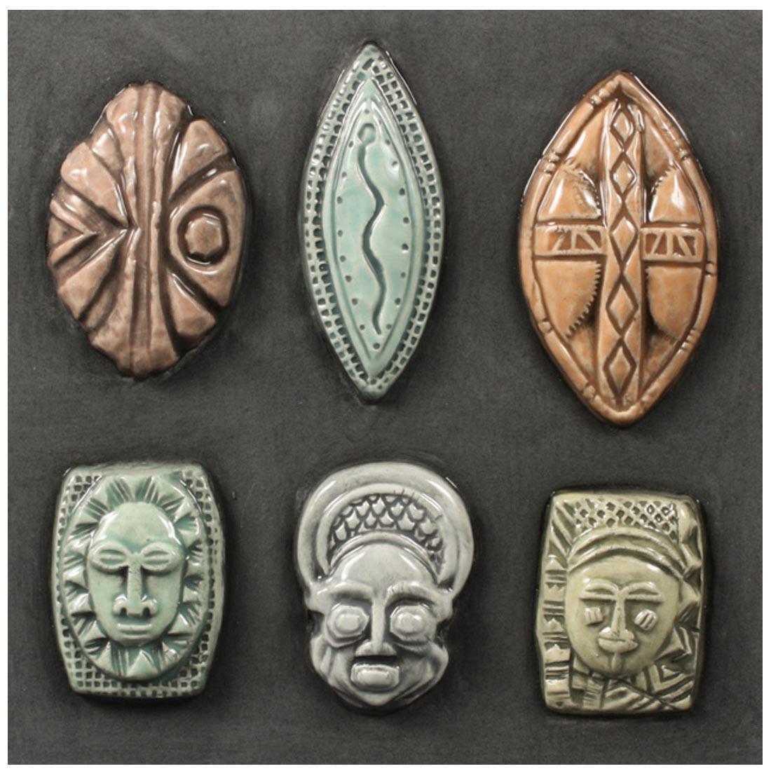 Clay pieces made from Mayco African Masks & Shields Sprig Molds