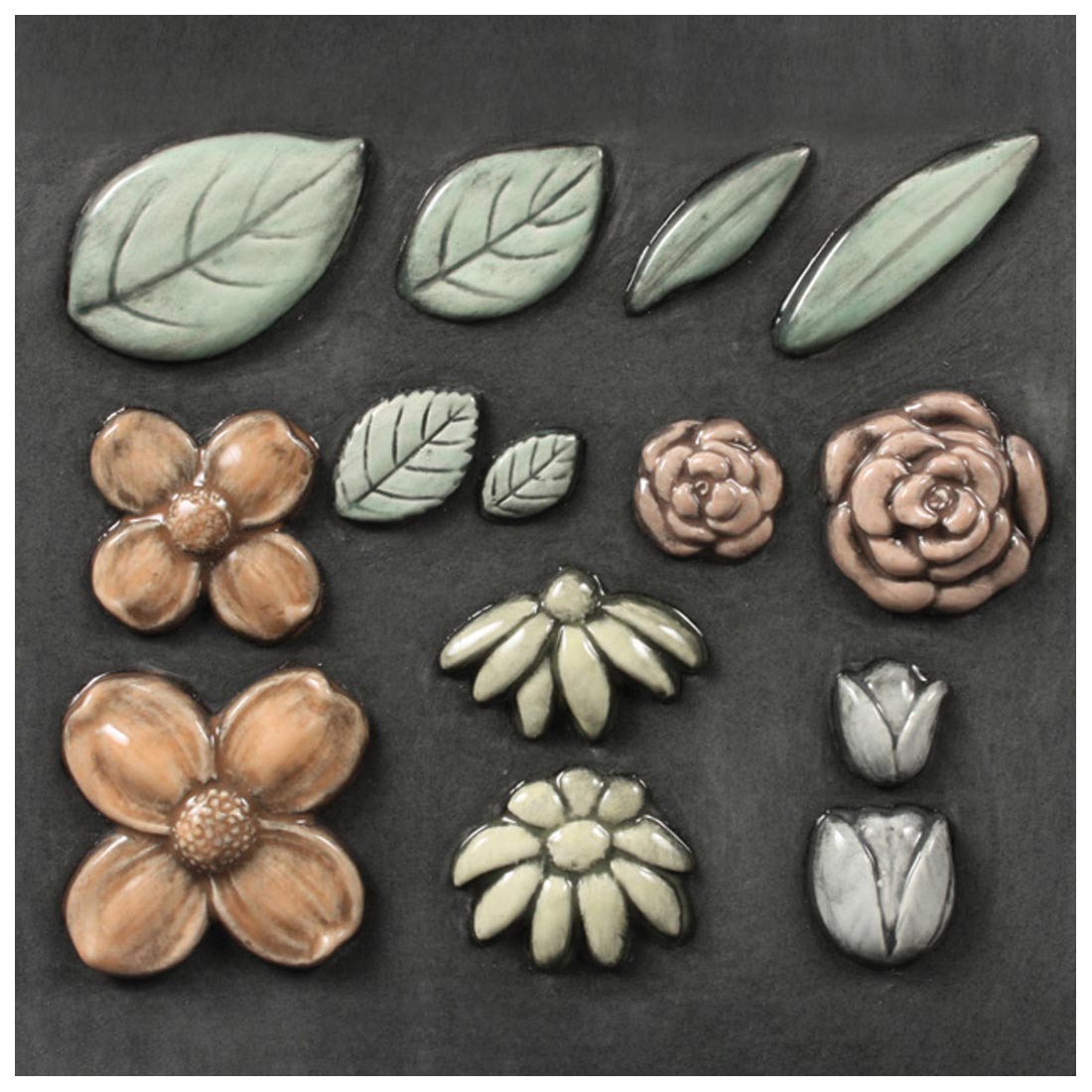 Clay pieces made with Mayco Flowers & Leaves Sprig Molds