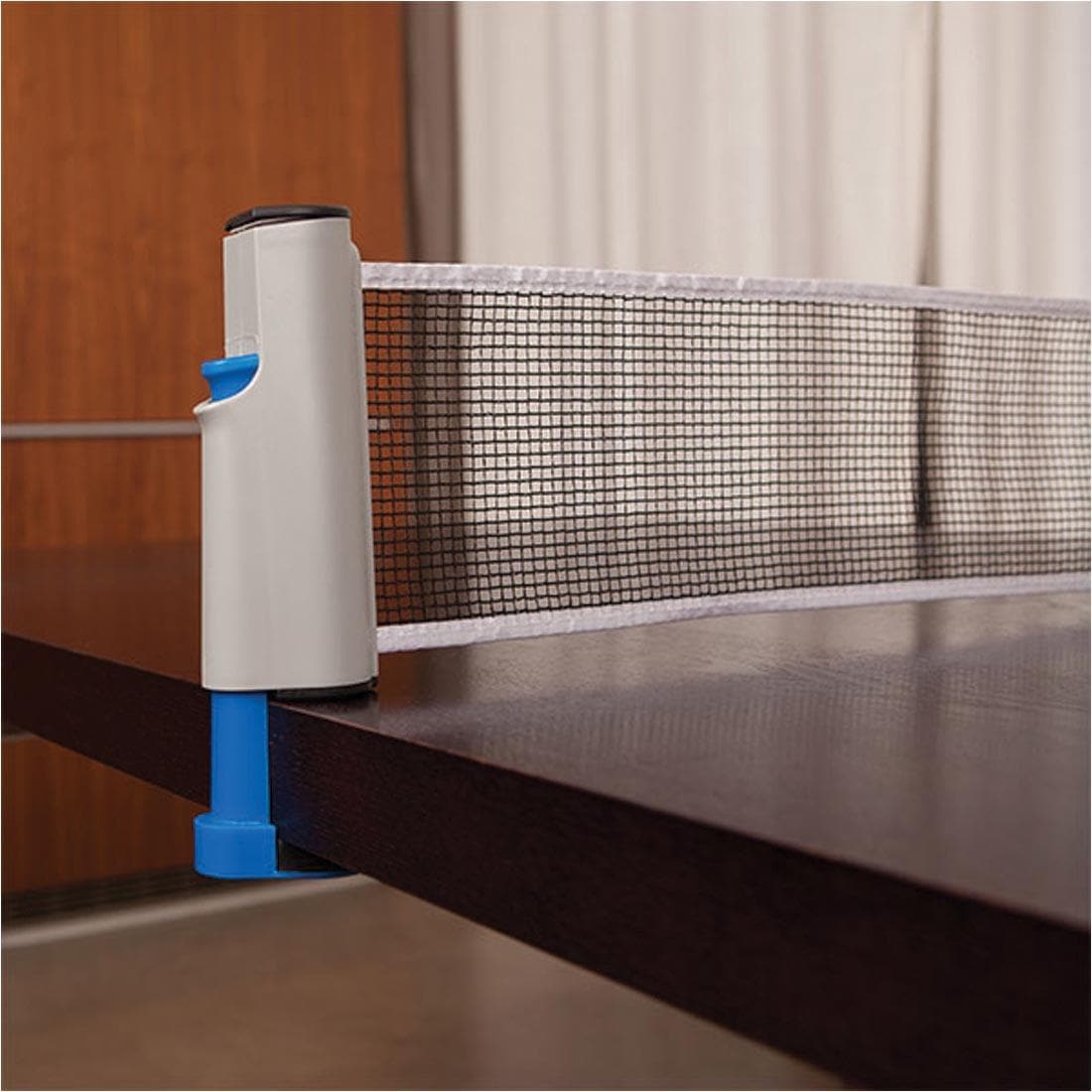 one end of the net from Champion Sports Anywhere Table Tennis Set attached to a table