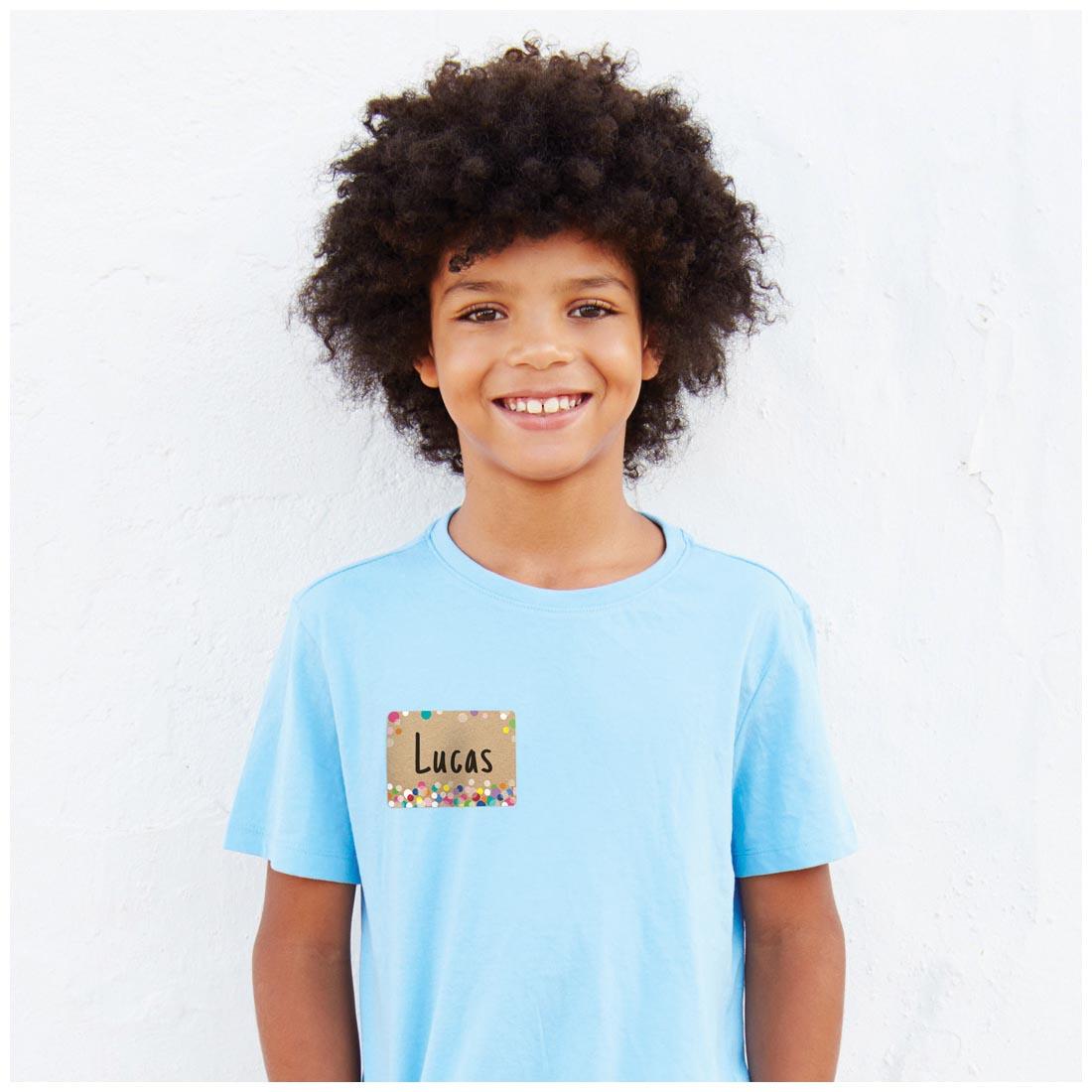 child with a Colorful Kraft Bubbles Label from the Krafty Pop Collection By Creative Teaching Press as a name tag on their shirt