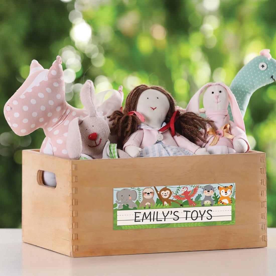 box of toys labeled with a Name Plate from the Jungle Friends collection by Creative Teaching Press