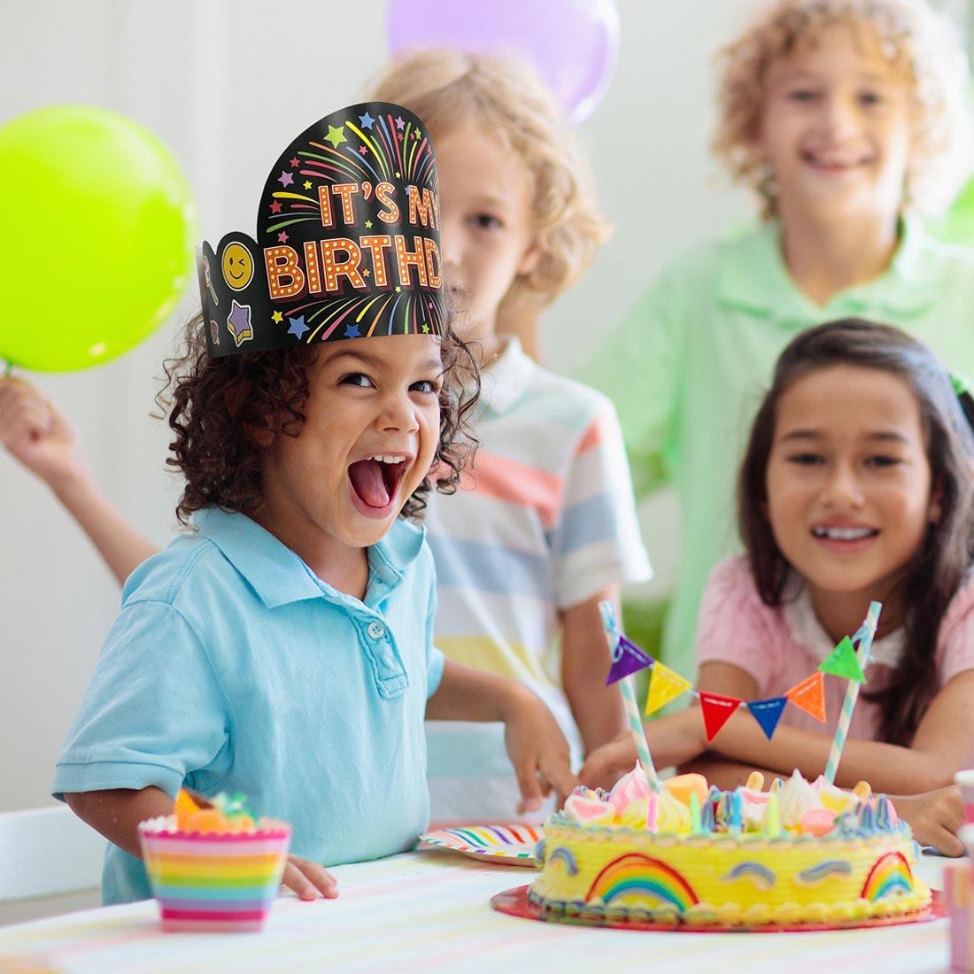 4 children in a party atmosphere, one wearing a Happy Birthday Crown from the Core Decor collection by Creative Teaching Press