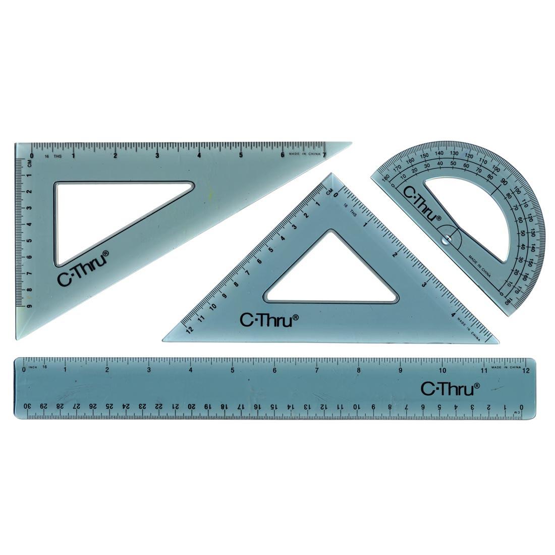 set of 2 triangles, a protractor and a ruler