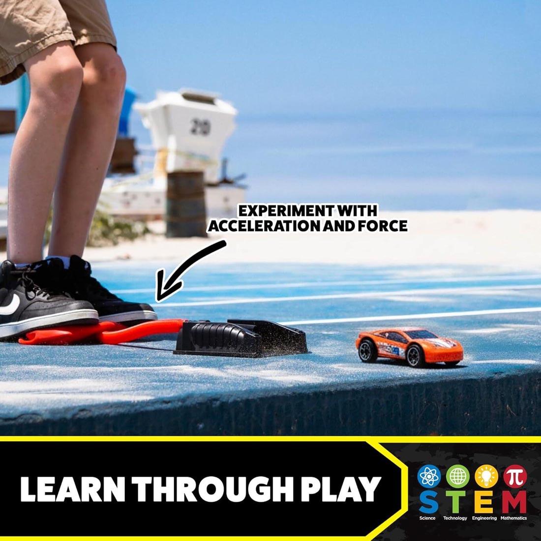 feet on a Stomp Rocket Dueling Stomp Racer plus text Experiment with acceleration and force; Learn through play; STEM