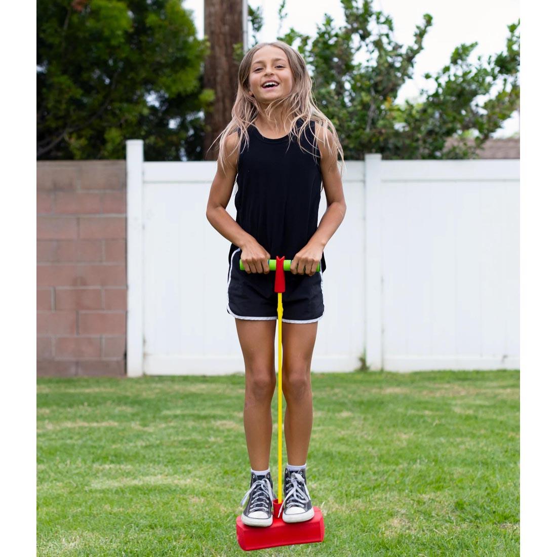 child on a Stomp Rocket Stomp Hopper
