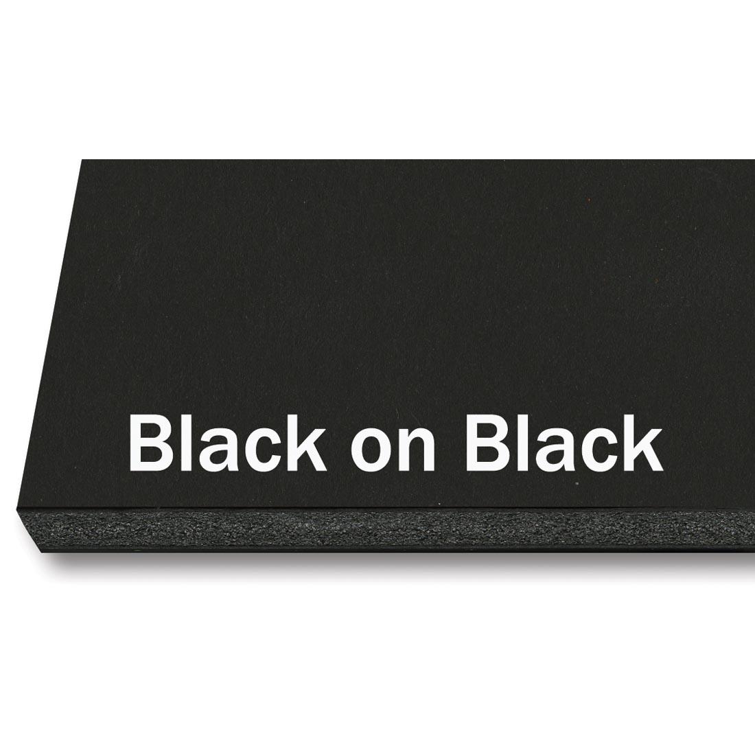 portion of black foam board sheet with black core