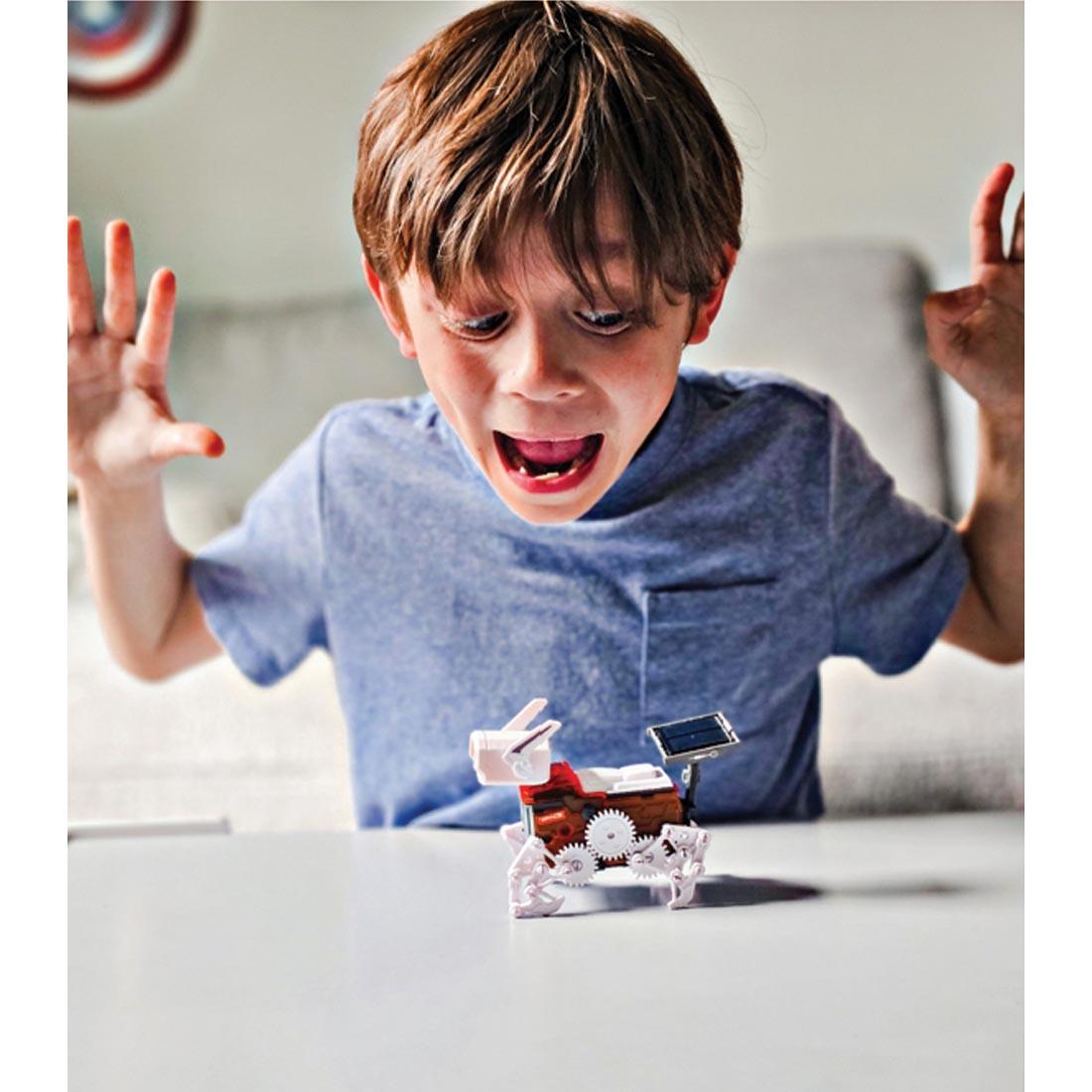 child amazed by the completed Teach Tech Robo Dog