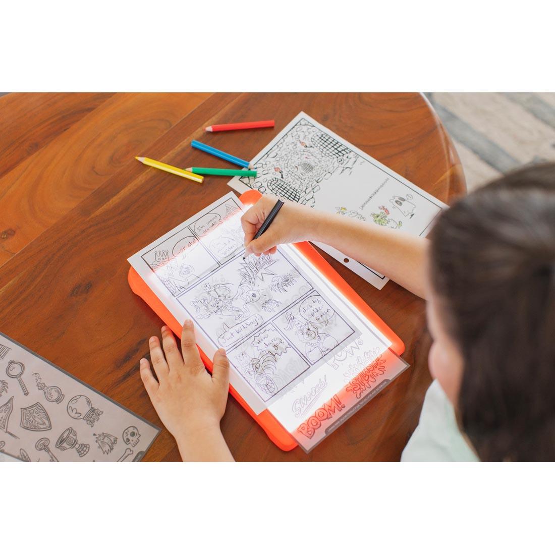 child using the Graphic Novel Kit With Brady Smith By Educational Insights
