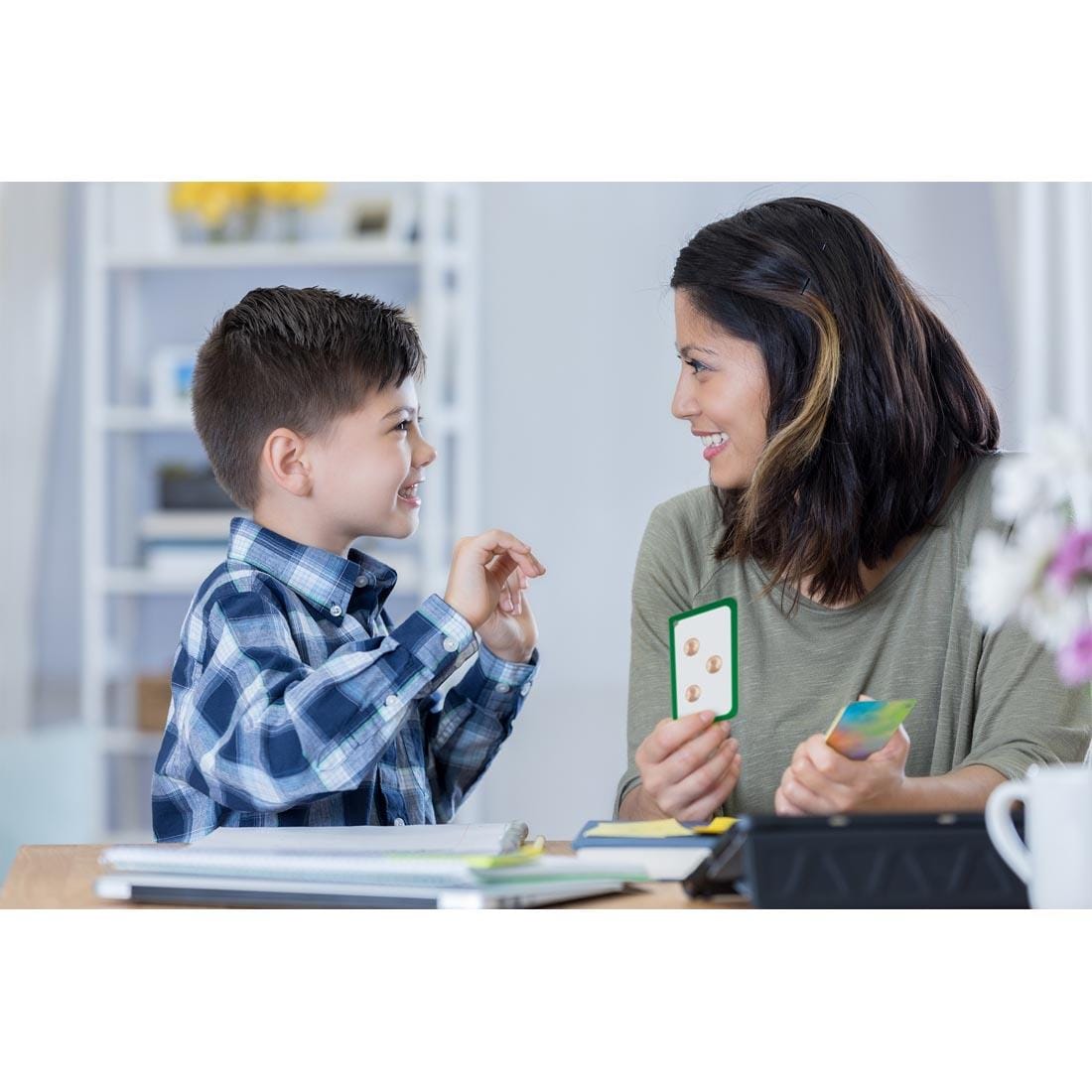 child and adult interacting with Number Sense Flash Cards