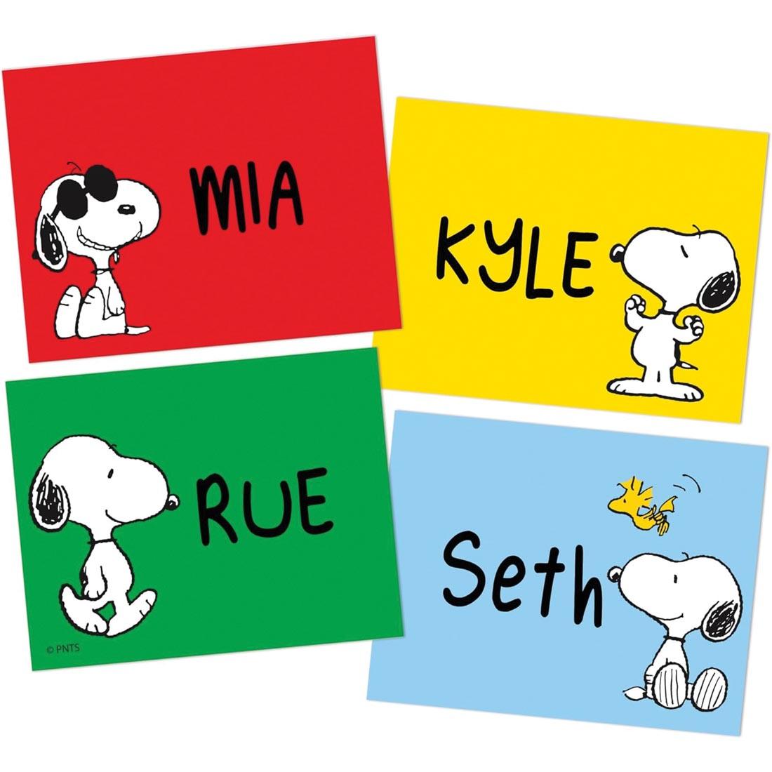 Four Snoopy Name Tags from the Peanuts collection by Eureka with names written on them