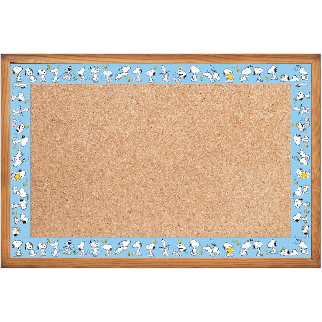 bulletin board bordered with Snoopy Lineup Straight Deco Trim from the Peanuts collection by Eureka