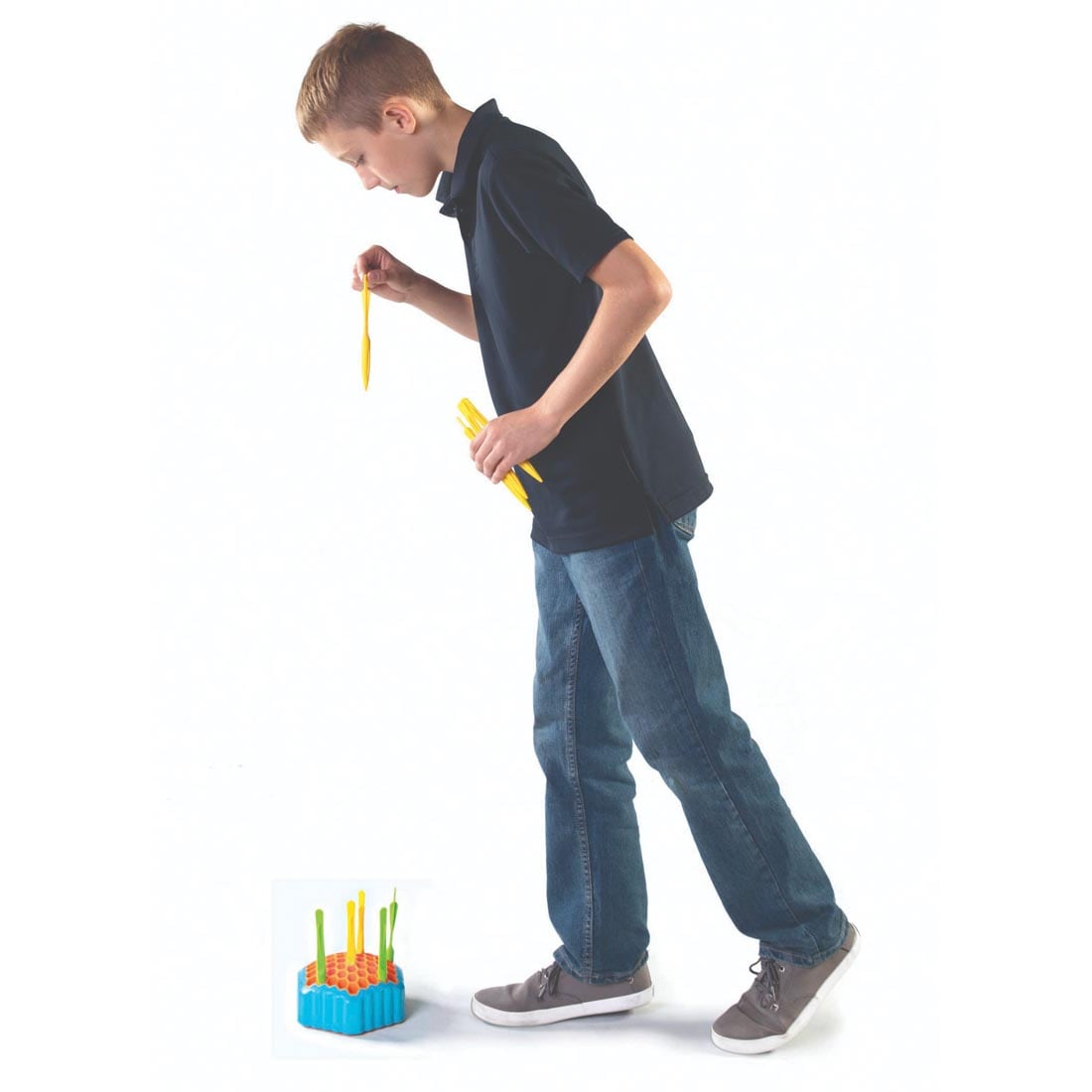 child standing over the Drop Shot Game