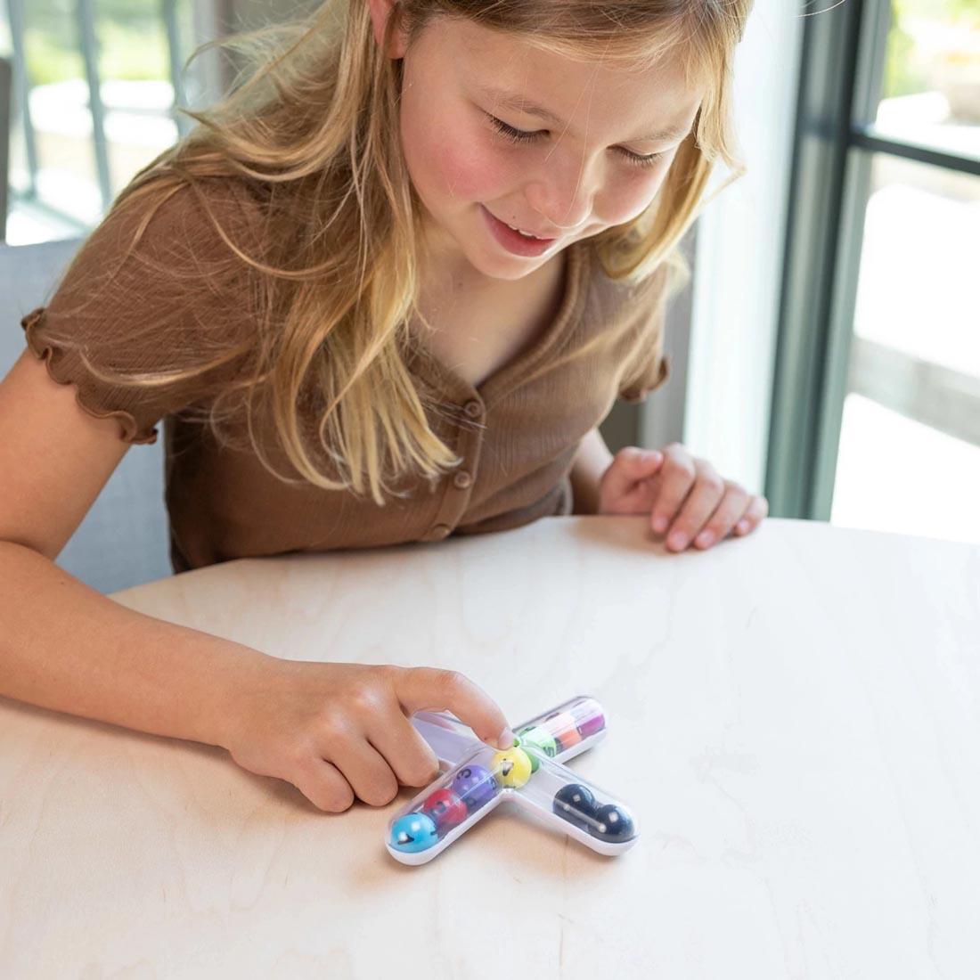 child playing with Tiltago Game