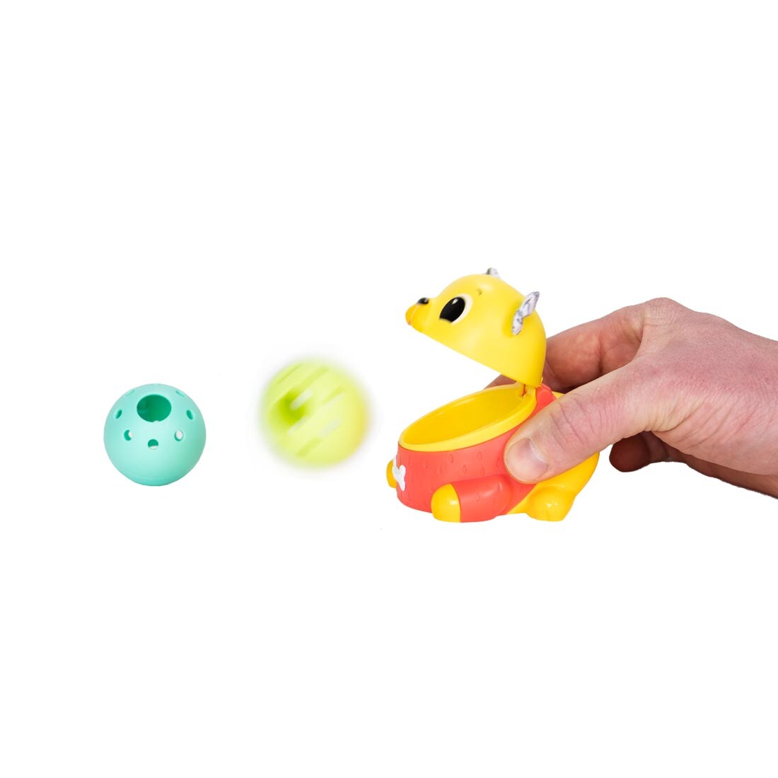 hand holding the Crawl & Chase Pug Popper By Lamaze as it pops a ball out of its mouth