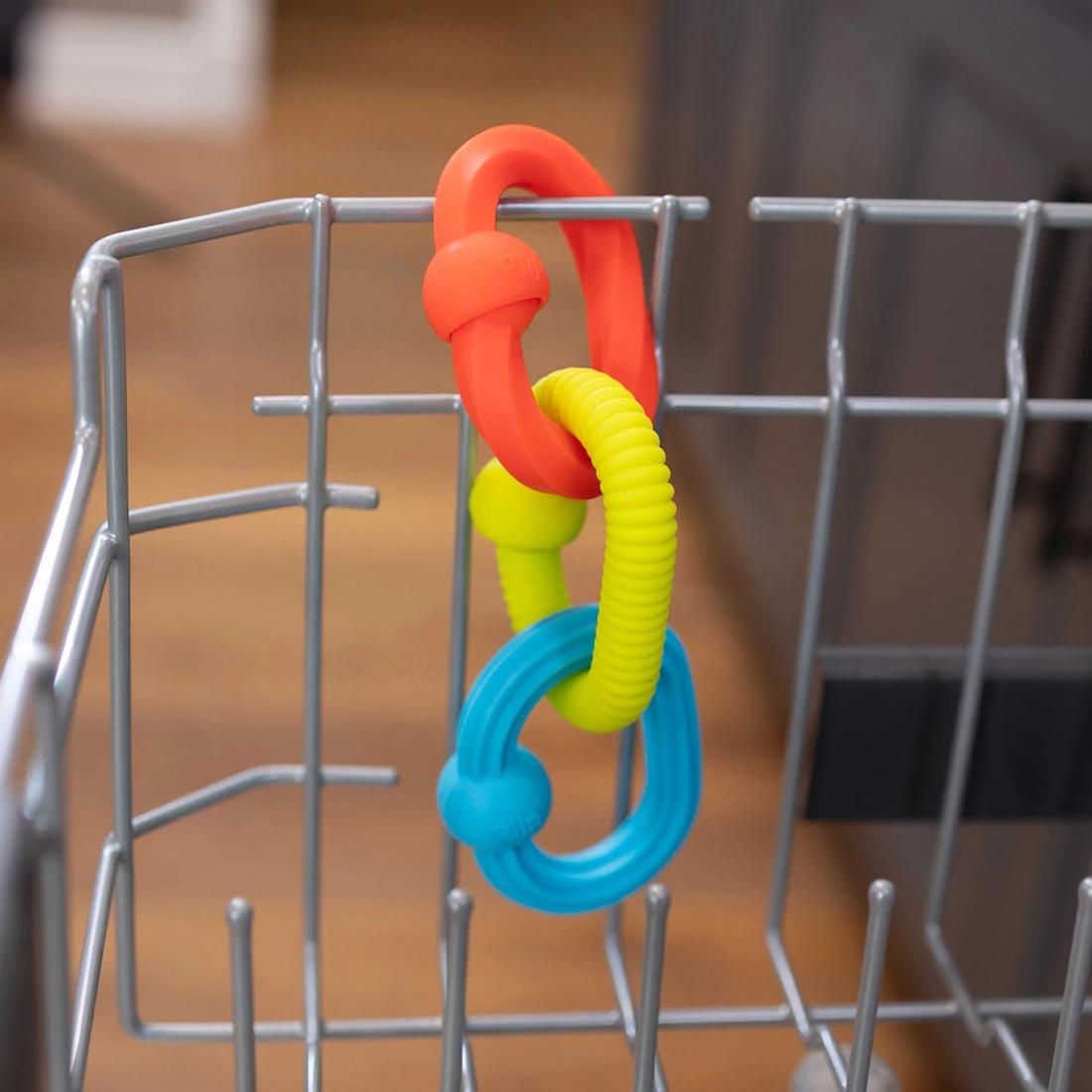 Plip Grips attached to a dishwasher rack