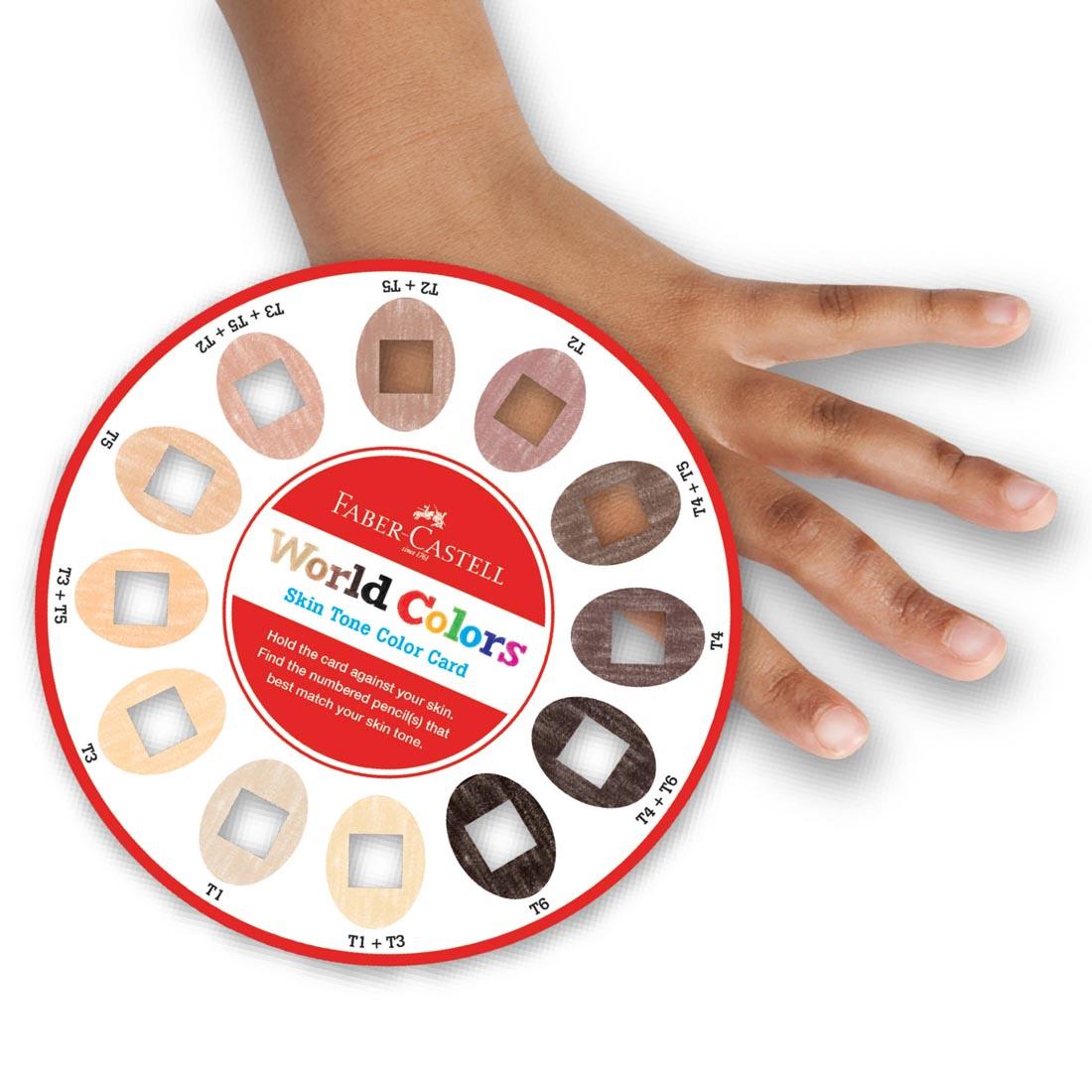 Child's hand matching up to the skin tone color card from the How To Draw Faces Set by Faber-Castell