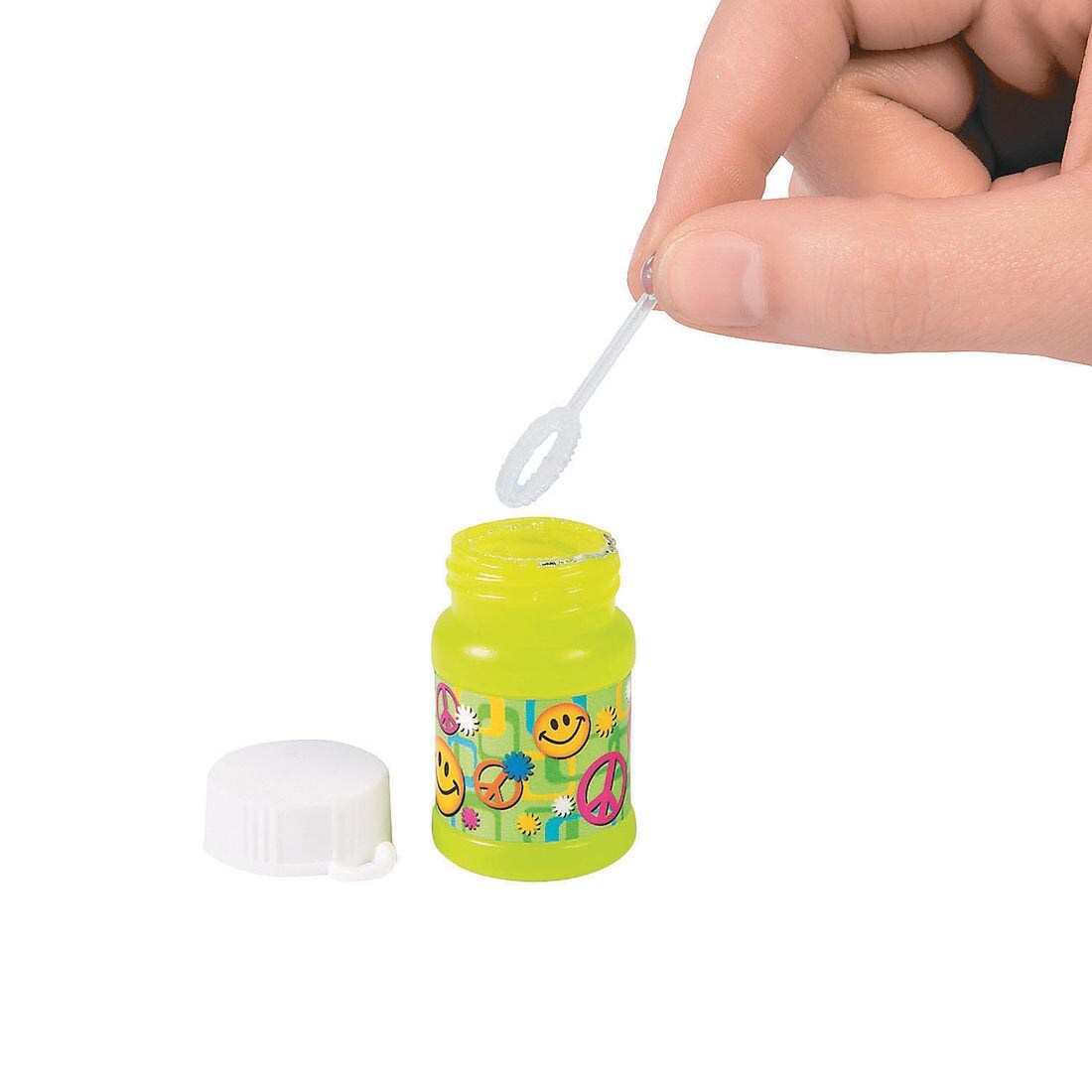 hand holding the wand over a bottle from Mini 60s Bubble Bottles By Fun Express