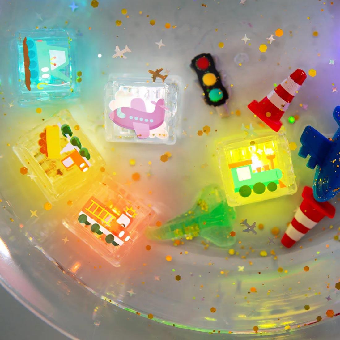 Set of Auto Glo Pals Water-Activated Light Up Cubes in water