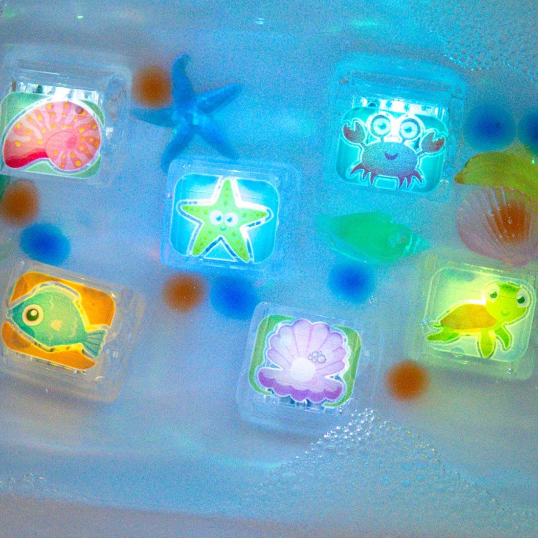 set of Ocean Glo Pals Water-Activated Light Up Cubes in water