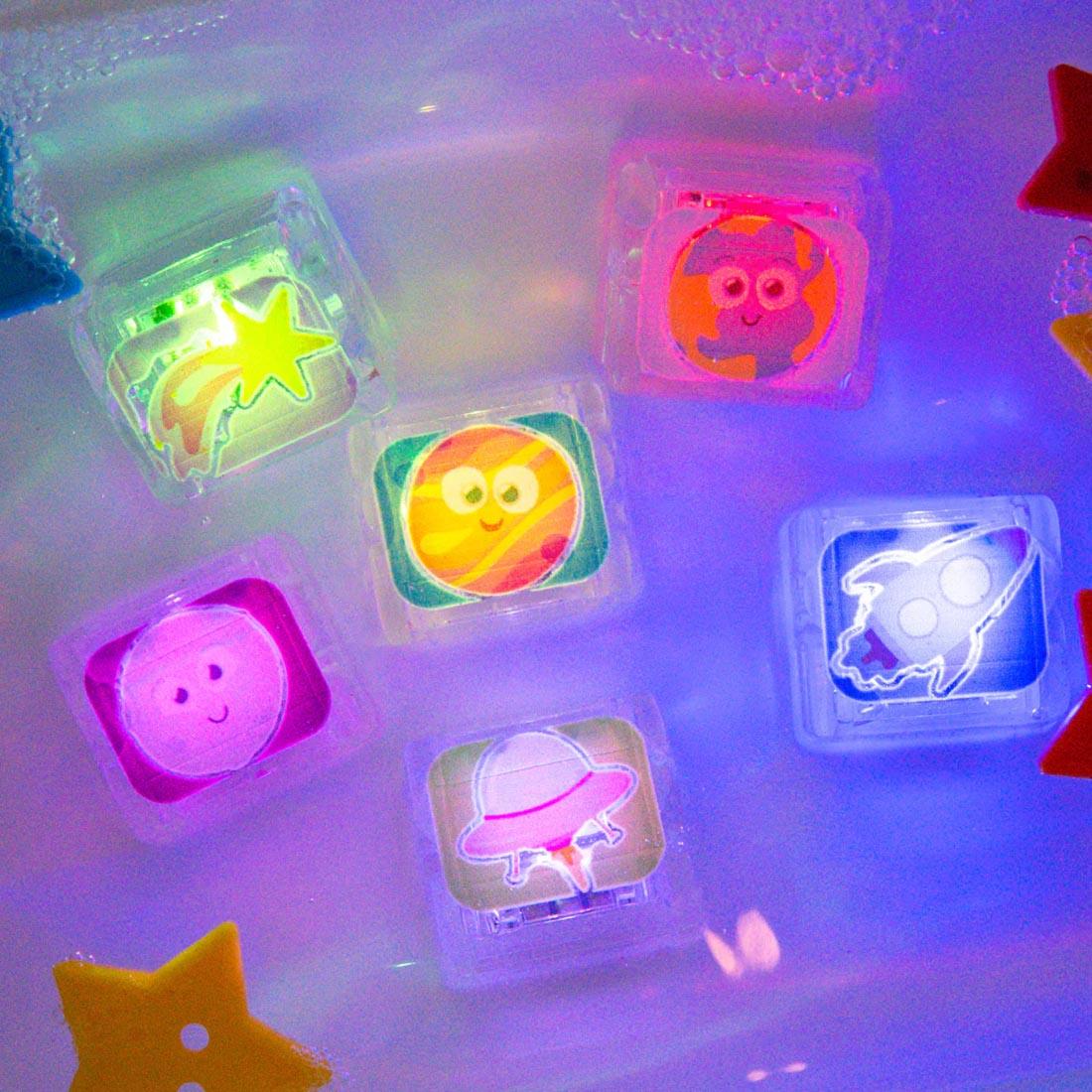 set of Space Glo Pals Water-Activated Light Up Cubes in water