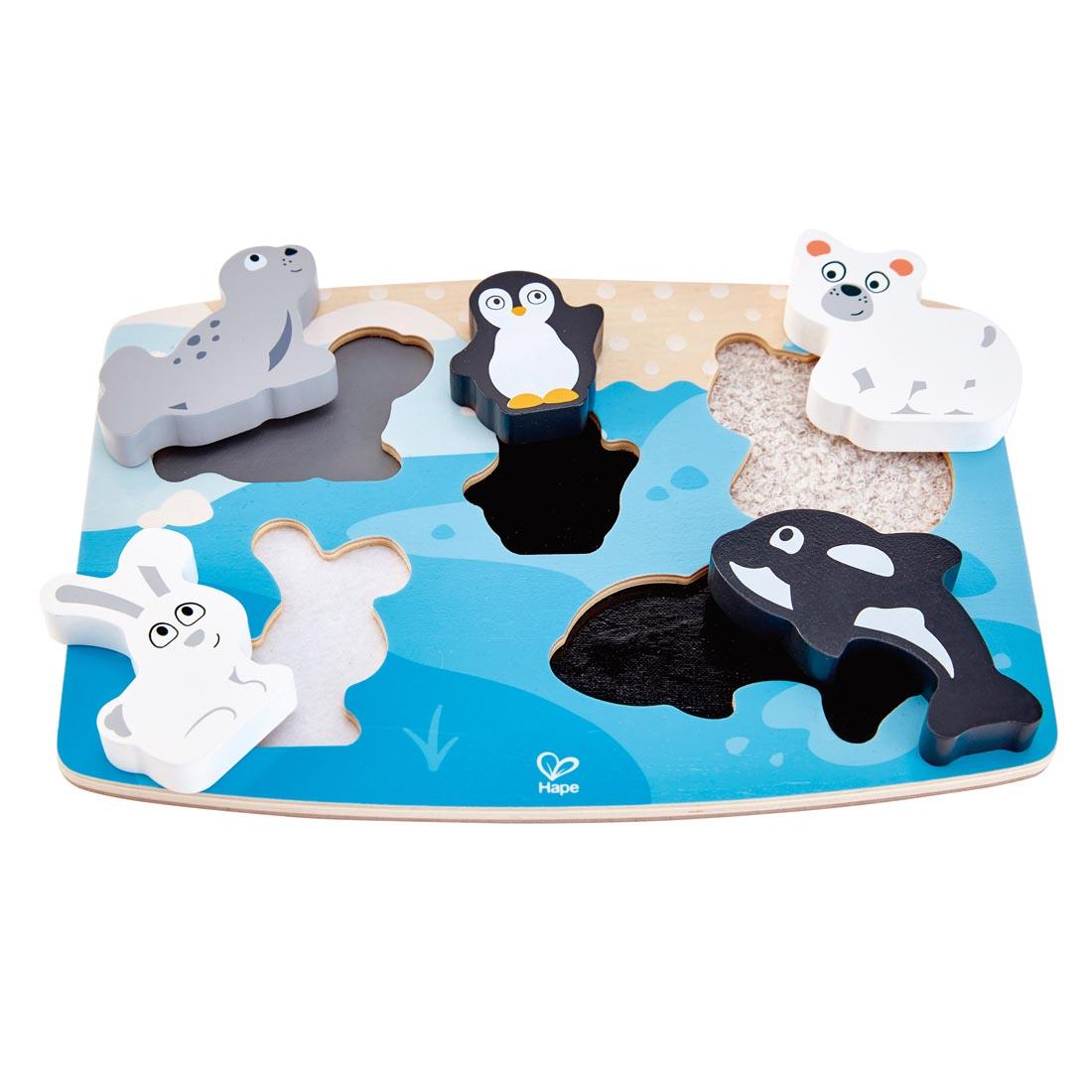 Hape Polar Animal Tactile Puzzle with pieces sitting outside their spaces