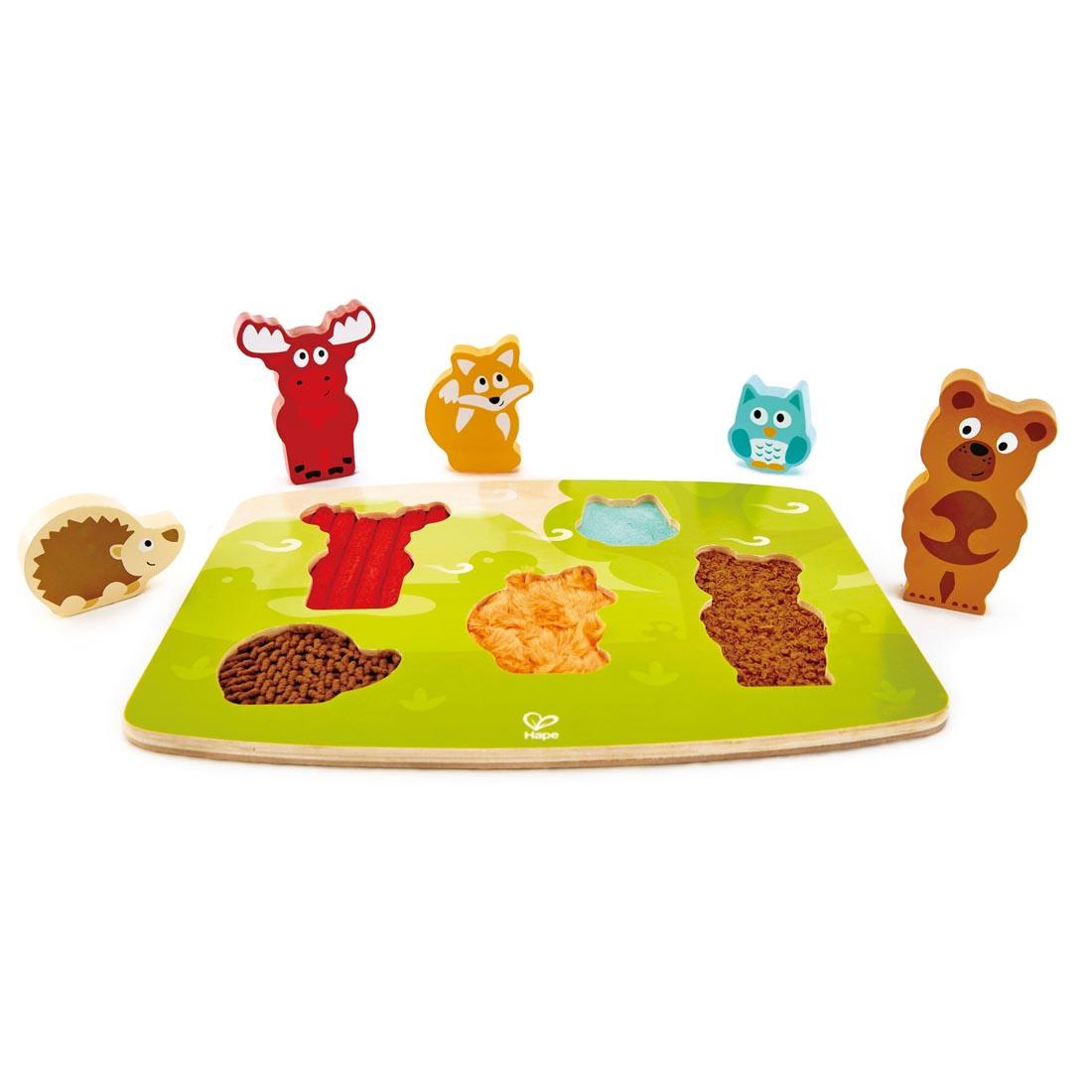 Hape Forest Animal Tactile Puzzle with the animal pieces standing outside the puzzle tray