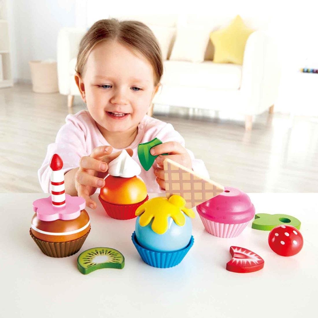 Child playing with the Cupcakes Play Set By Hape