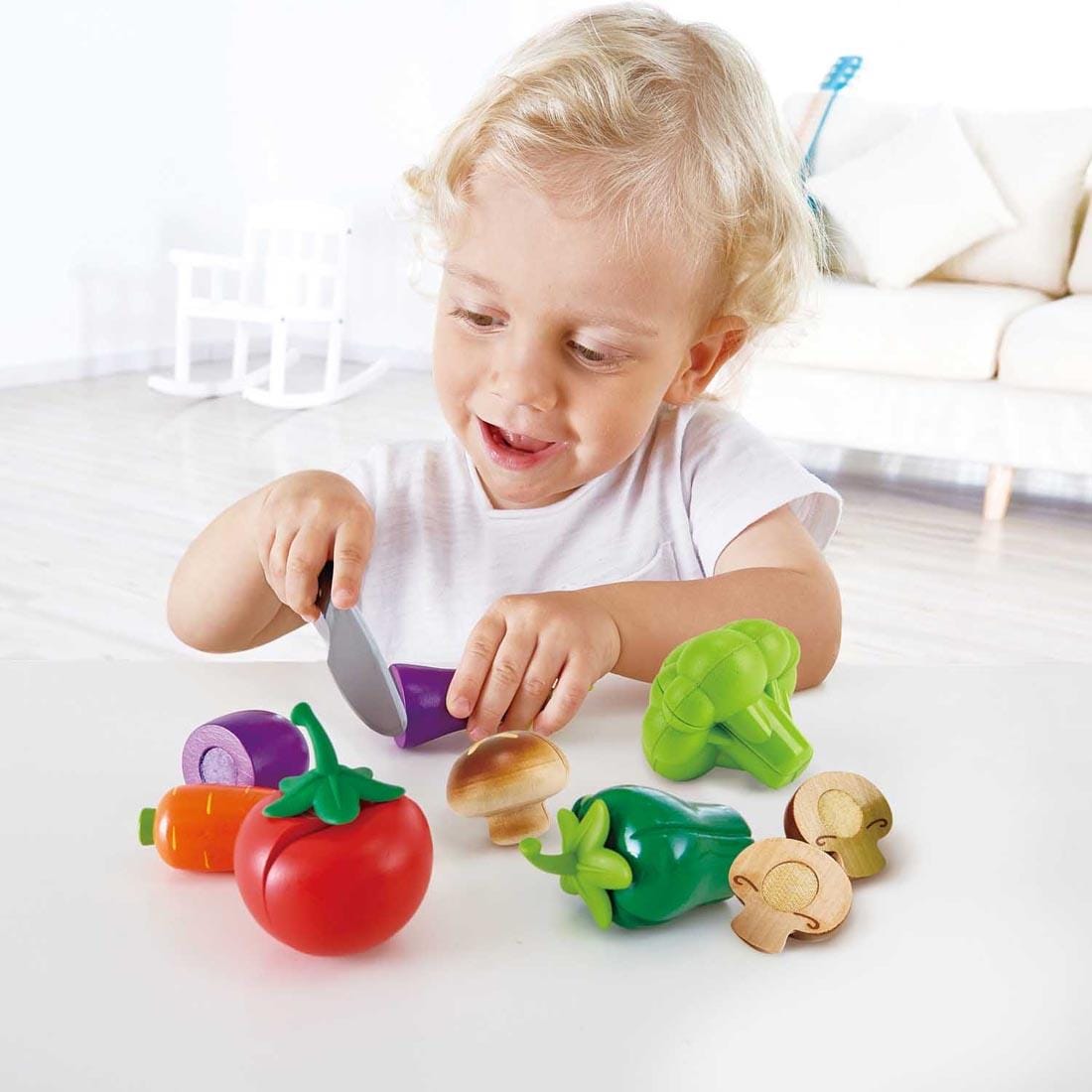 Child playing with the Garden Vegetables Play Set By Hape